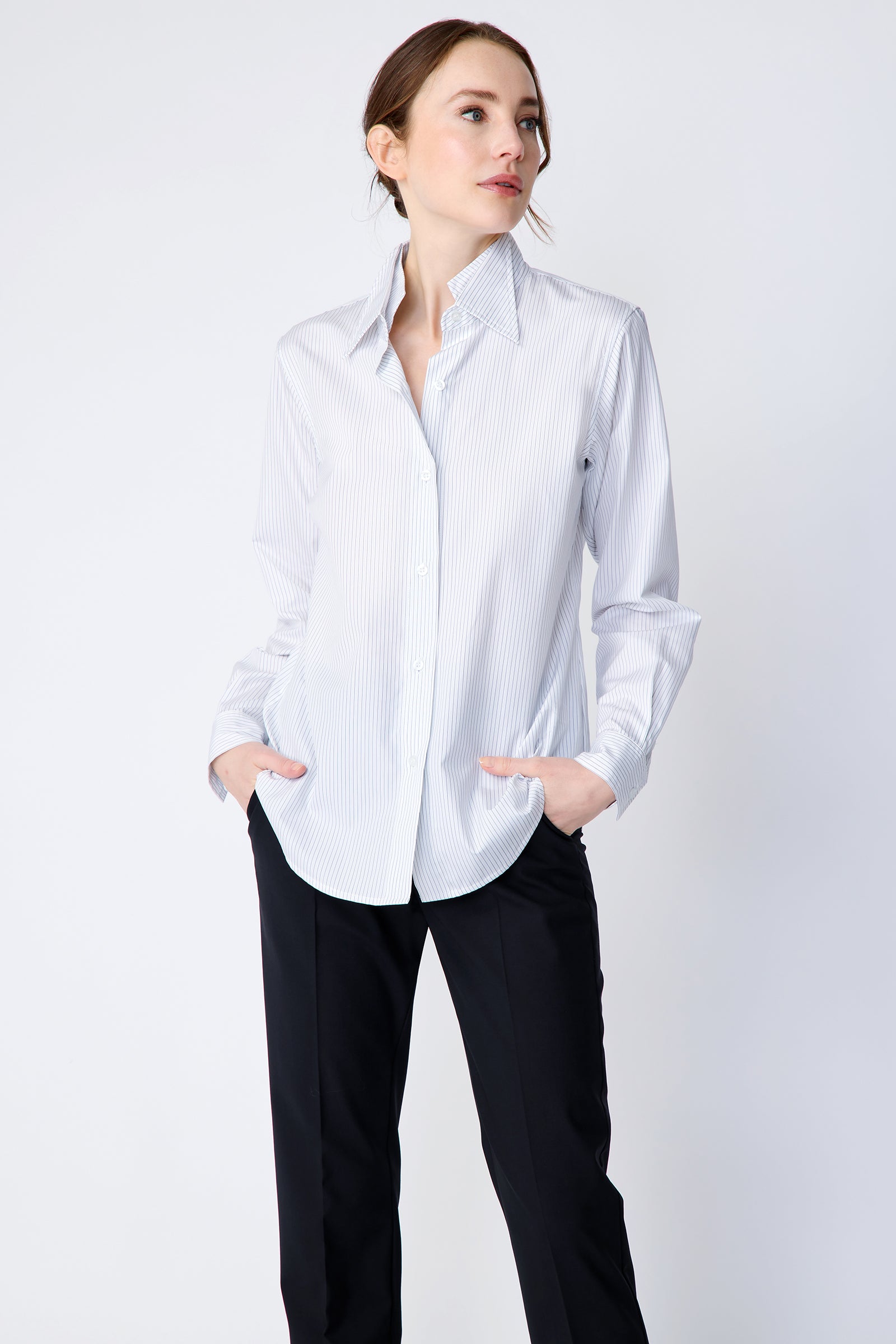 Kal Rieman Double Collar Shirt in pinstripe cotton on model front hands in pockets looking to the side