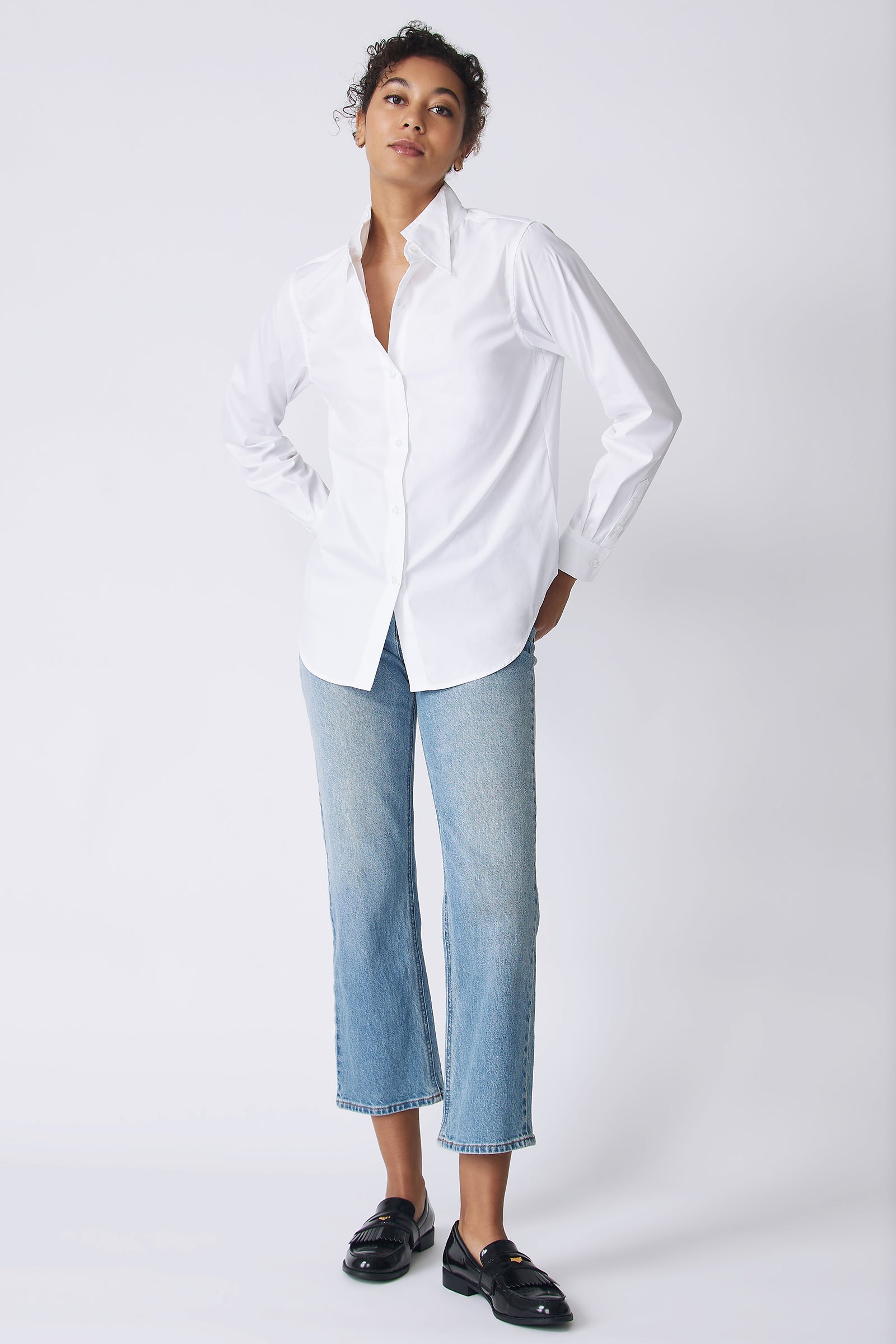 Kal Rieman Double Collar Shirt in white stretch poplin on model front view hands in back pockets