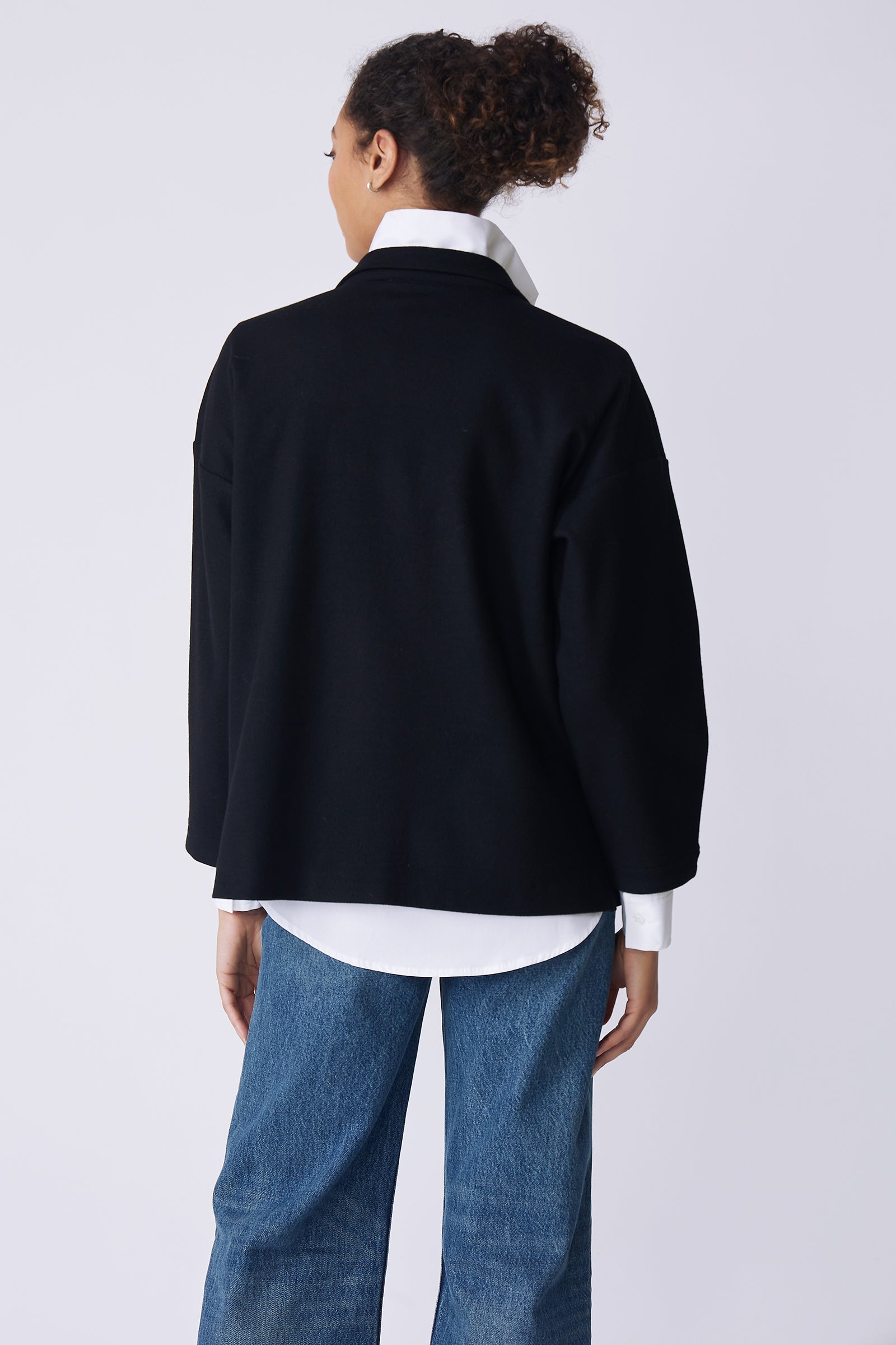 Kal Rieman Elaine Notch Placket Pullover in black Italian felted jersey on model back view