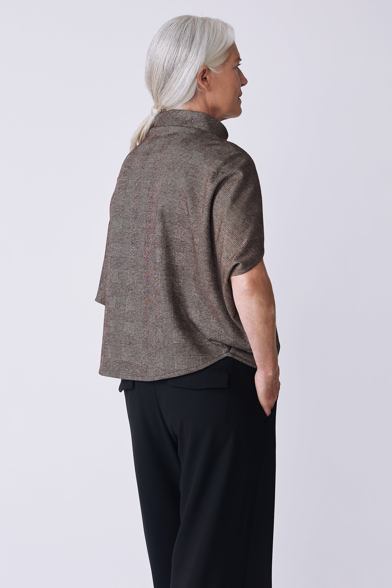 Kal Rieman Elsa Cape Top in brown plaid on model back view