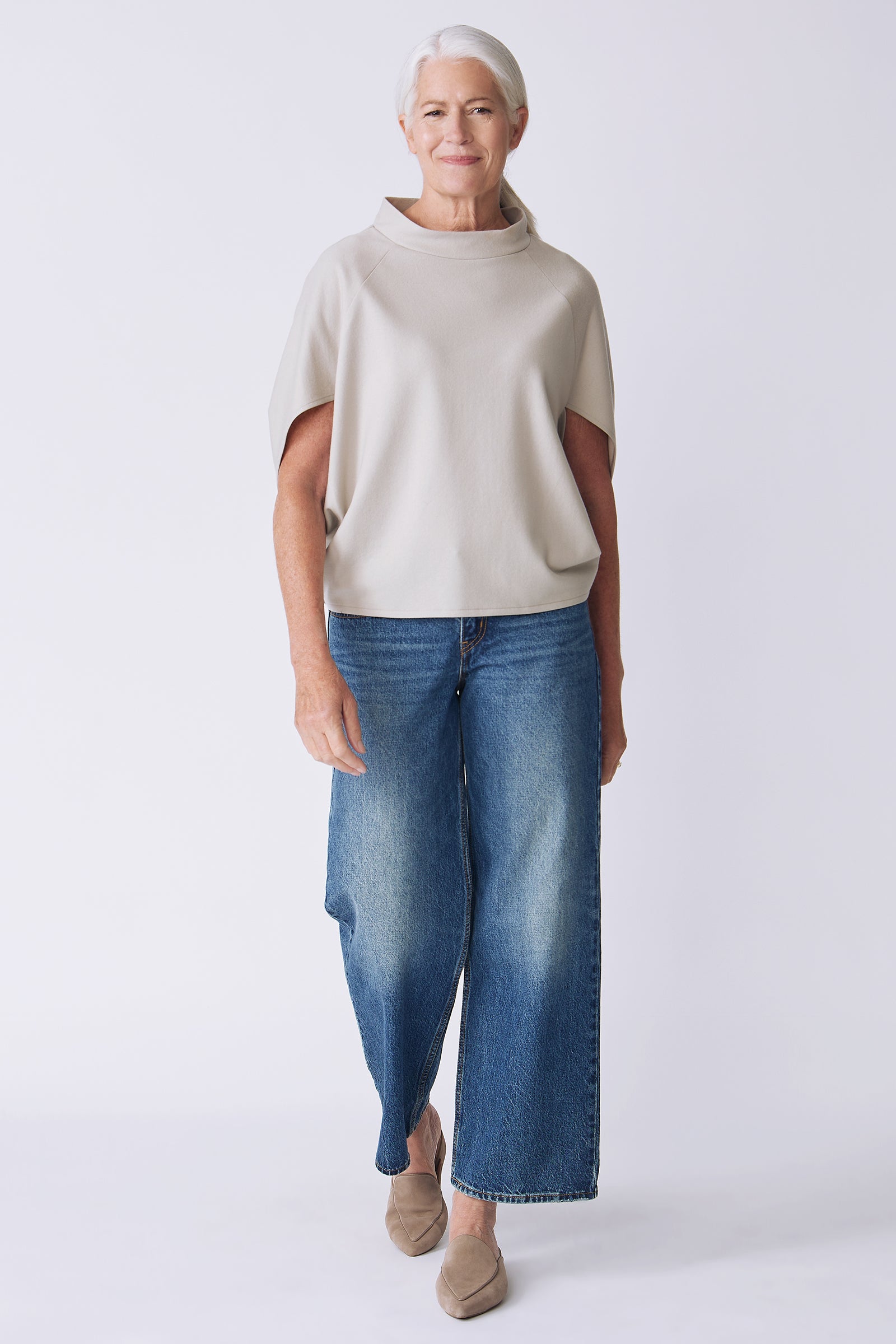 Kal Rieman Elsa Cape Top in mink felted jersey on model side view walking