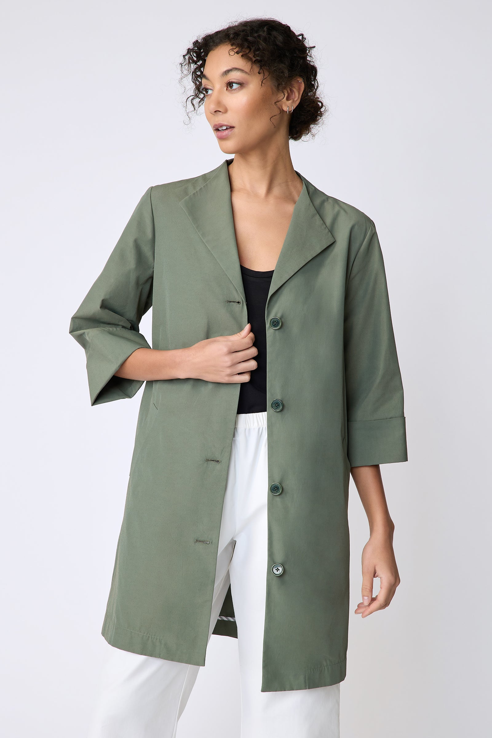 Kal Rieman Else Peacoat in Italian Broadcloth cactus on model front view holding front of jacket