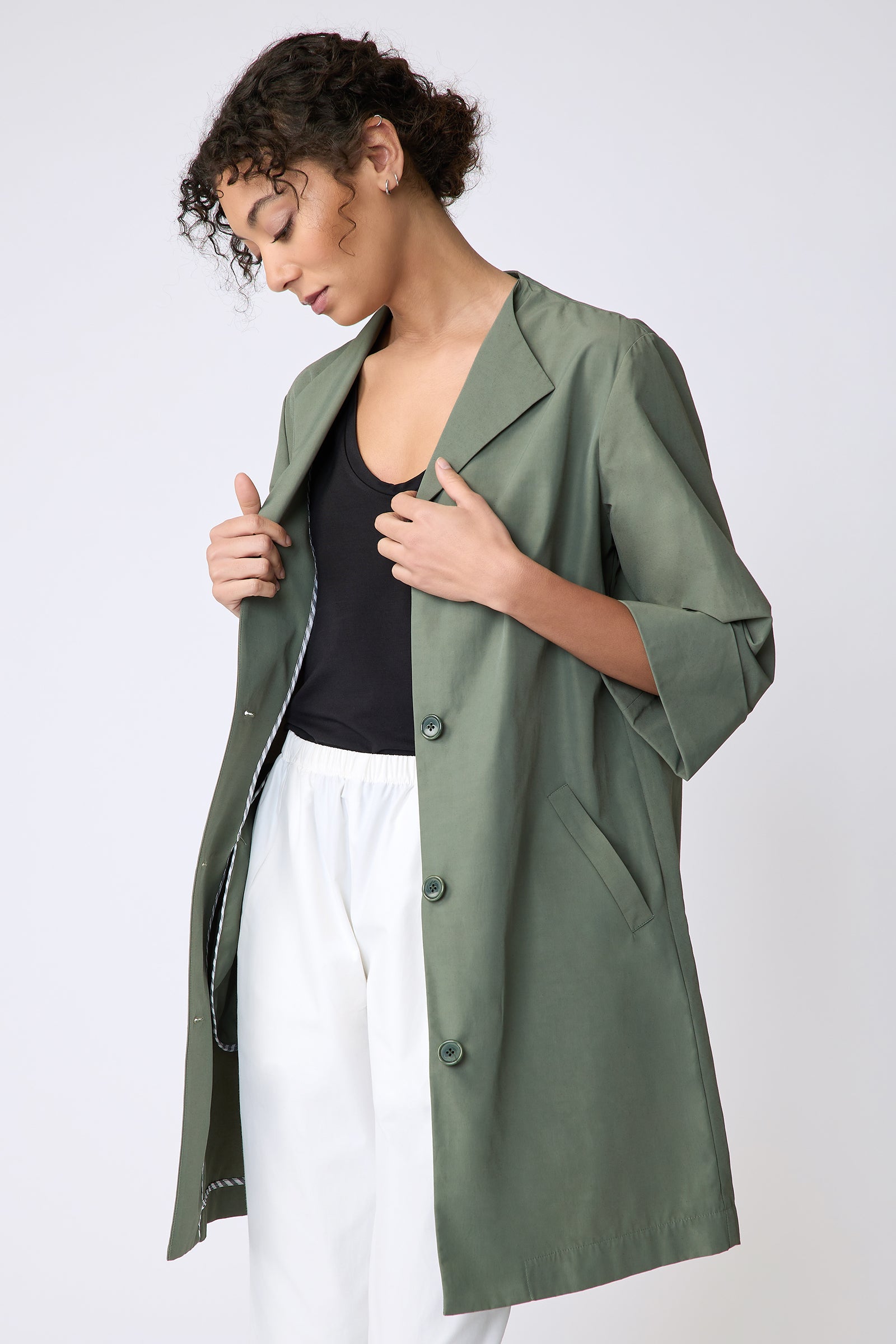 Kal Rieman Else Peacoat in Italian Broadcloth cactus on model side view holding jacket open