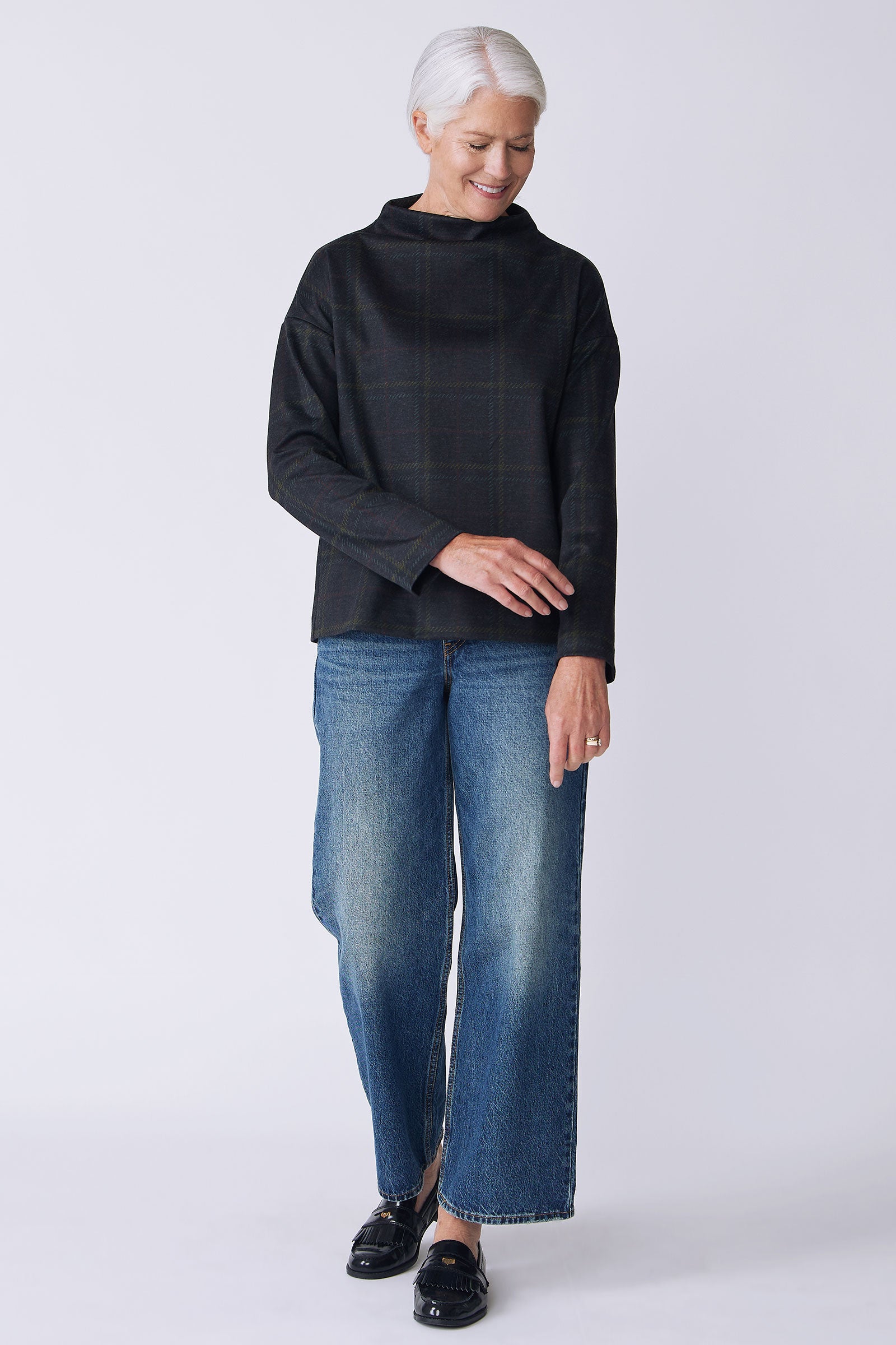 Kal Rieman Ethel Funnelneck in plaid ponte on model front view holding wrist