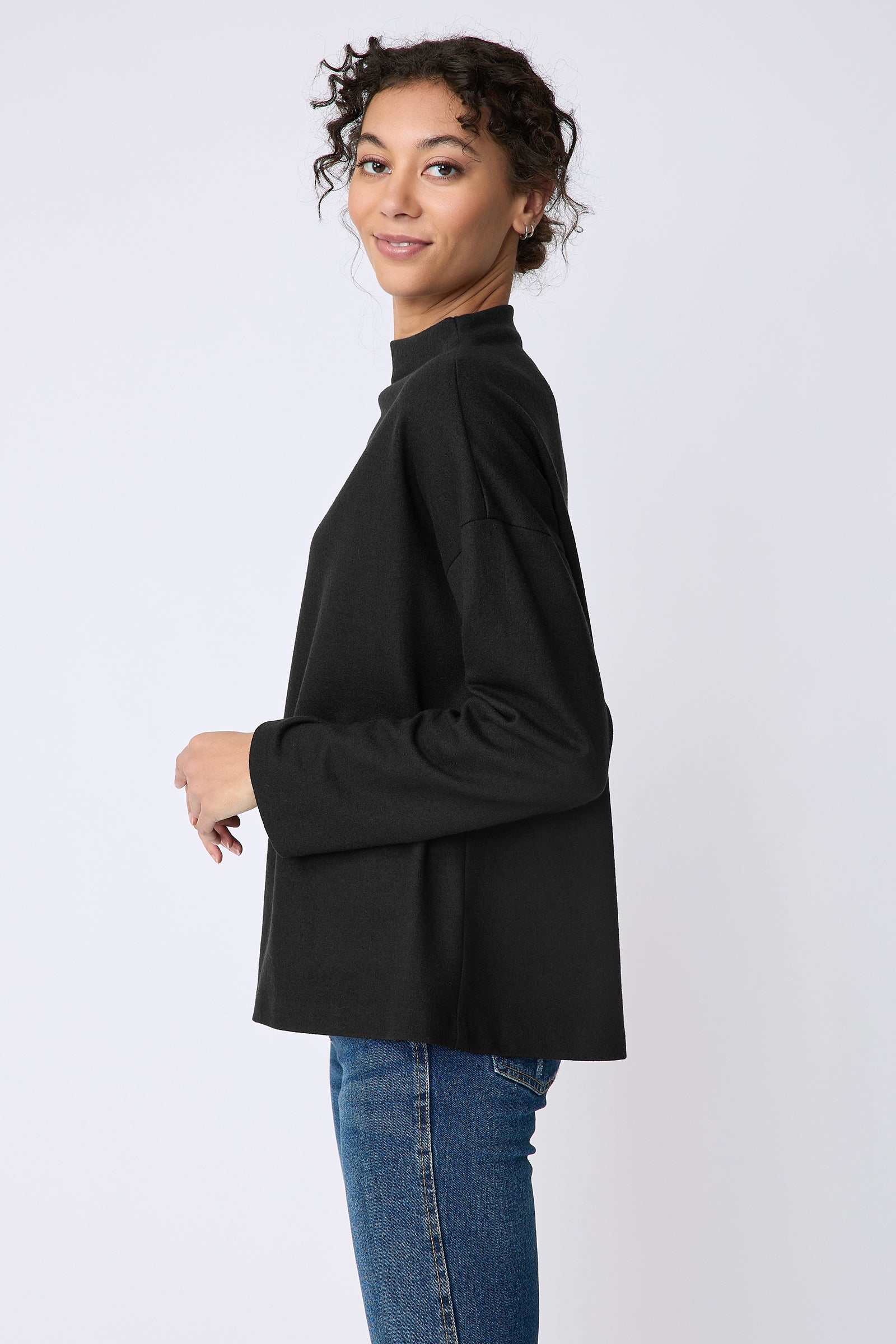 Kal Rieman Ethel mock funnelneck in black felted jersey on model side view