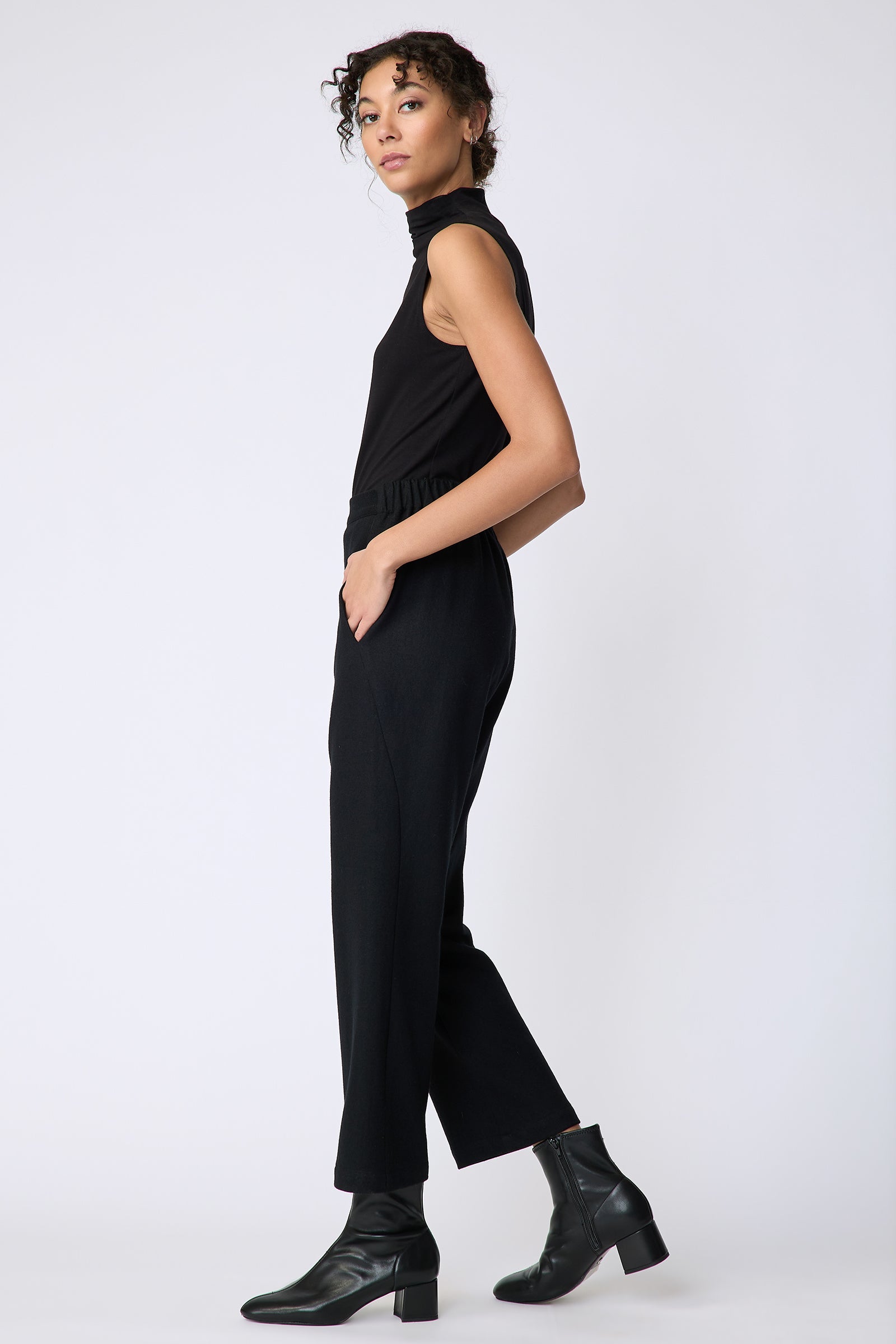 Kal Rieman Felted Jersey Angle seam crop pant in black on model side view walking