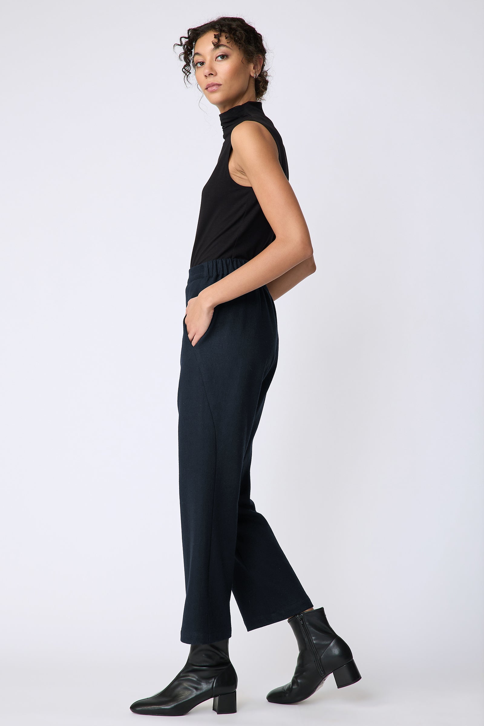 Kal Rieman Felted Jersey Angle seam crop pant in midnight on model side view walking