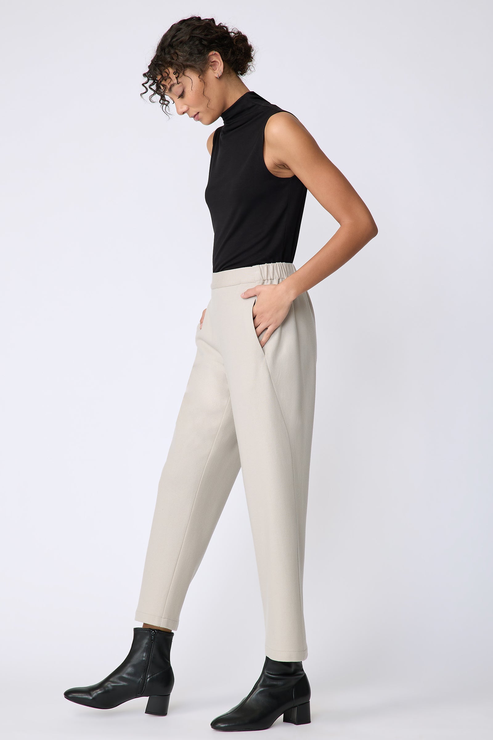Kal Rieman Felted Jersey Angle seam crop pant in mink on model side view hands in pockets