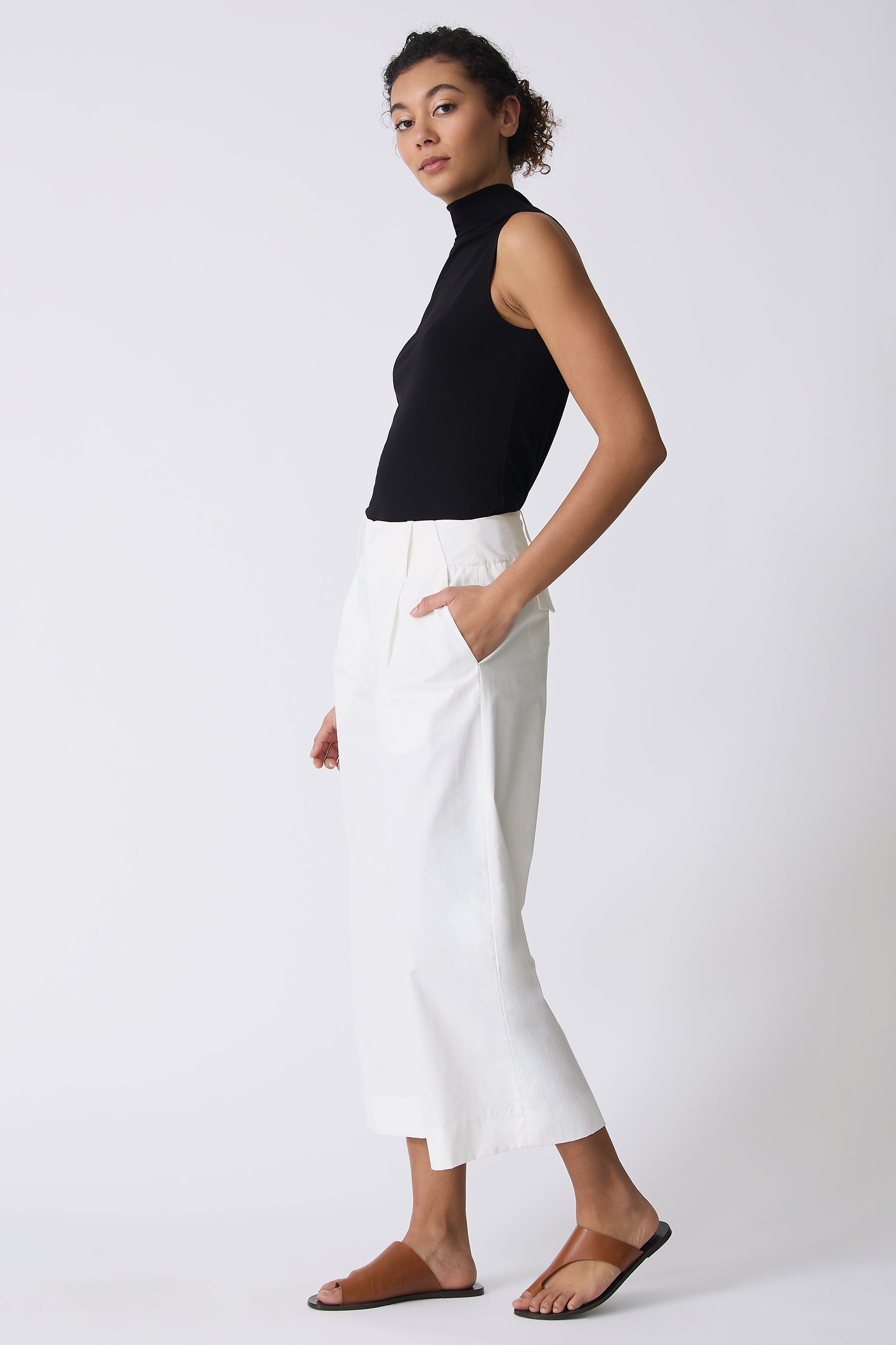 Kal Rieman Gabby Crop Pant in Ecru on model with hand in pocket full side view