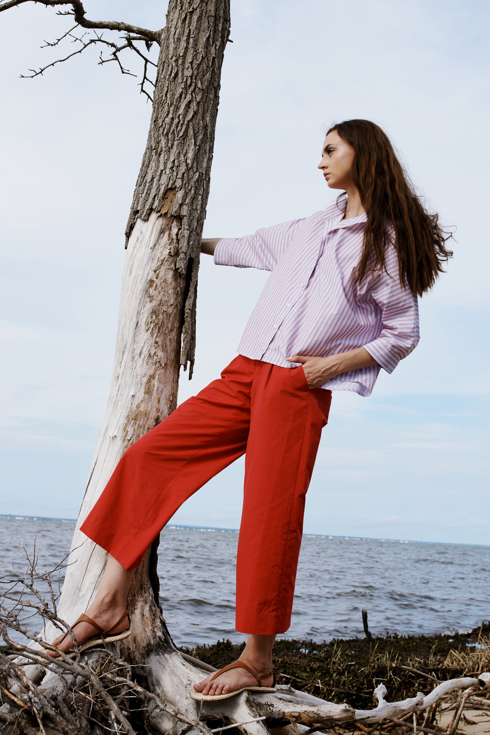 Kal Rieman Gabby Crop Pant in Red on model with hands in pockets full front view
