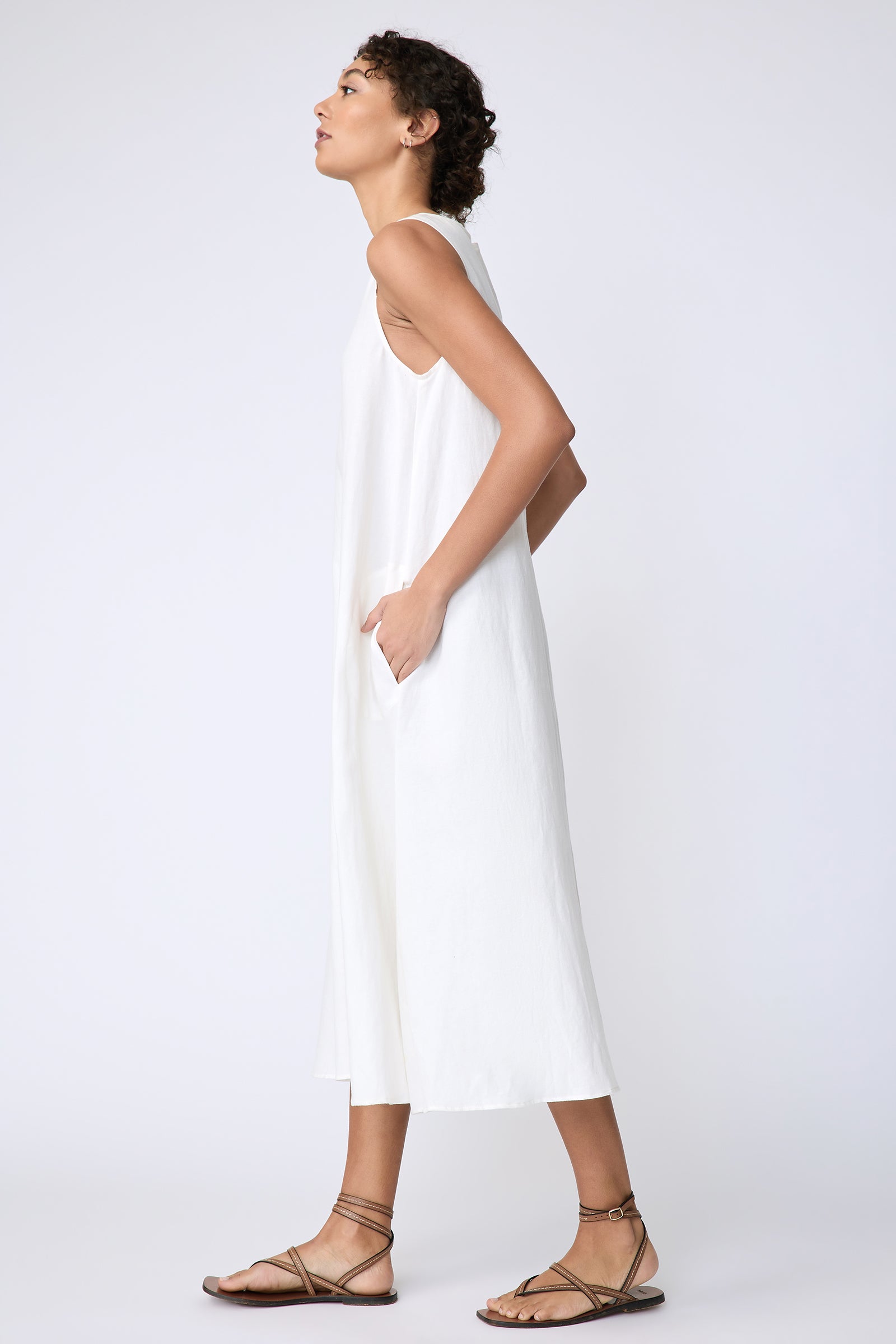 Kal Rieman Georgina Dress in Cotton Linen Ivory on model side view hands in pockets