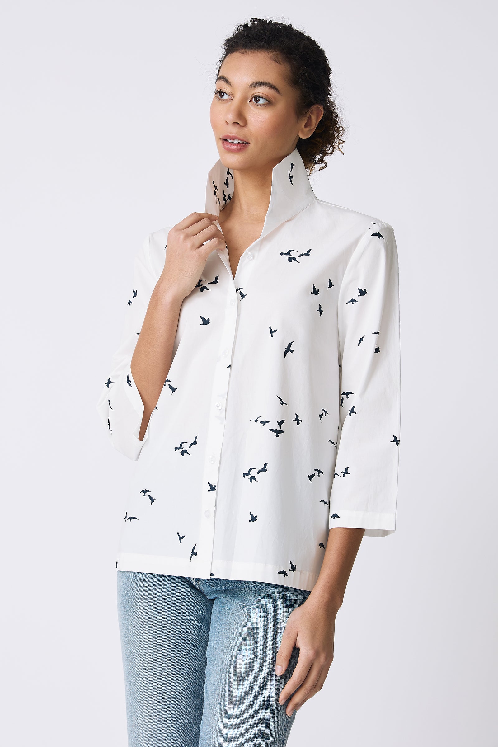 Kal Rieman 3/4 Sleeve Ginna Shirt in White Bird Print on model touching collar front view