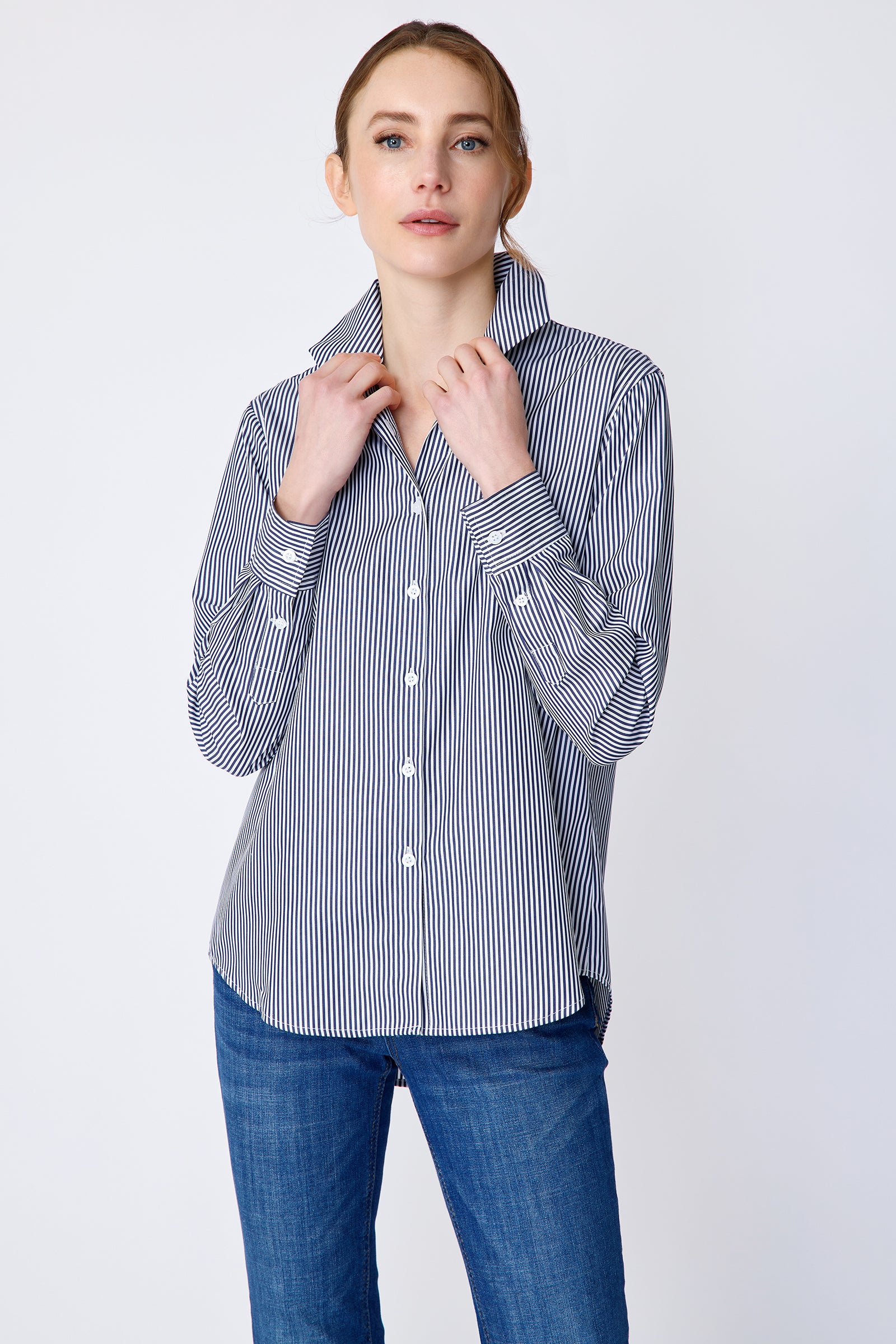 Kal Rieman Ginna Box Pleat Shirt in bengal stripe on model front view holding collar