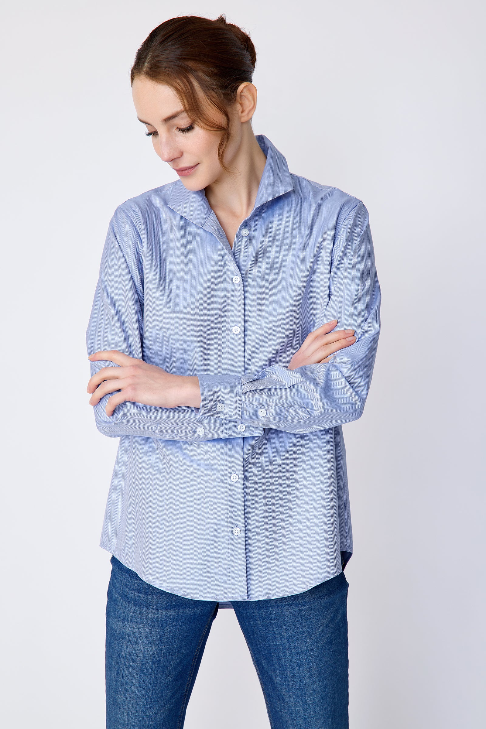 Kal Rieman Ginna Box Pleat Shirt in blue french blue herringbone on model front view looking down arms crossed