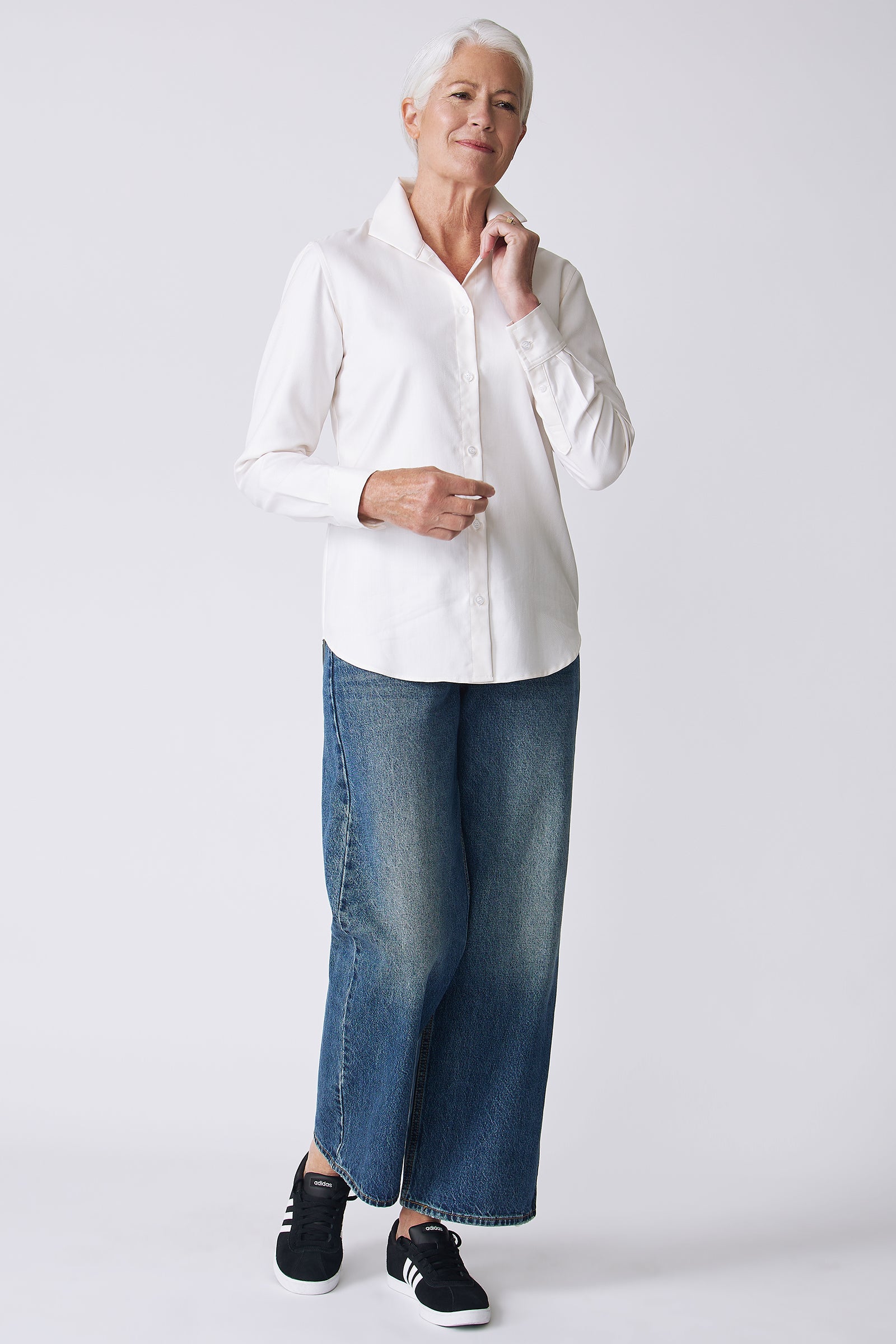 Kal Rieman Ginna Box Pleat Shirt in Ivory Fine Herringbone on Model Front View with hand on collar