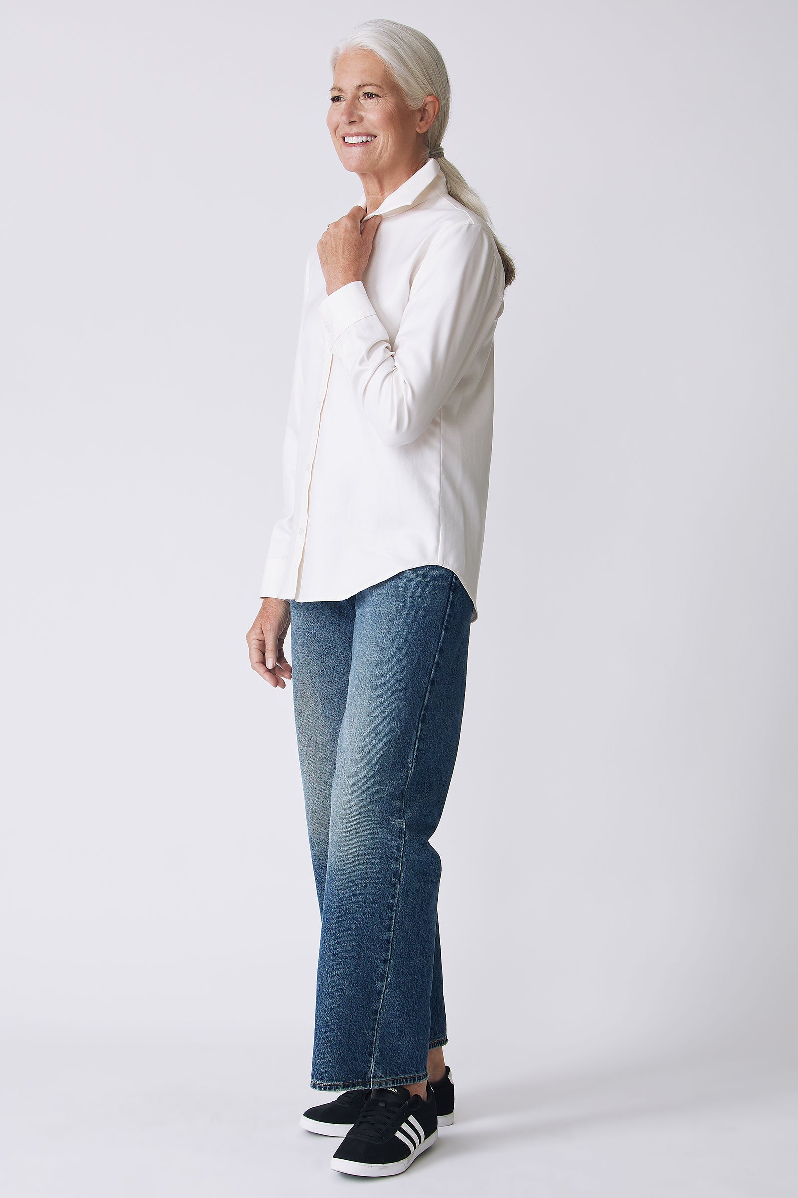 Kal Rieman Ginna Box Pleat Shirt in Ivory Fine Herringbone on Model side view holding collar