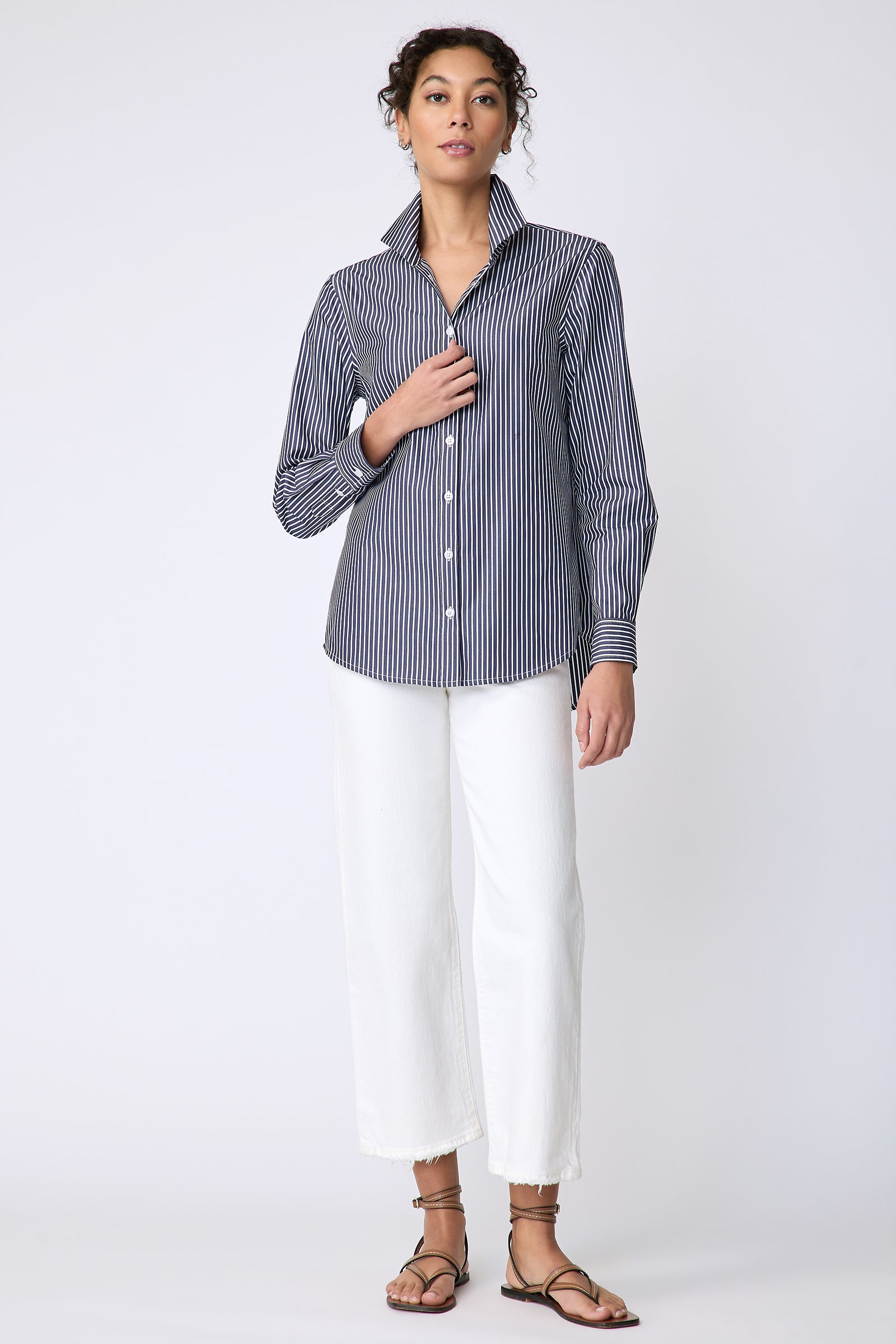 Kal Rieman Ginna Box Pleat Tailored Shirt in Savoy Stripe on model front view holding front of shirt