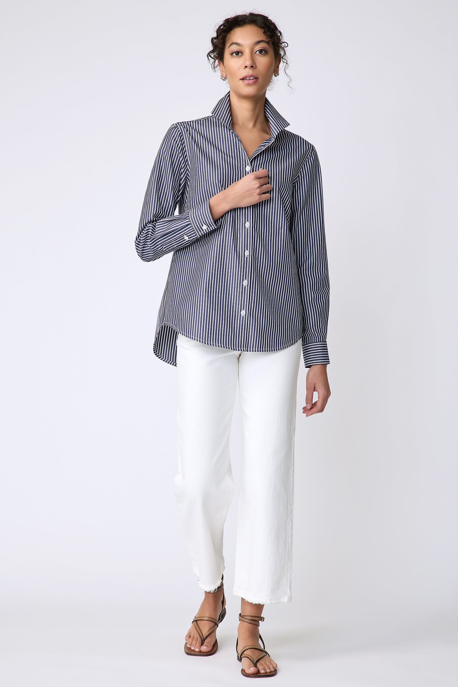 Kal Rieman Ginna Box Pleat Tailored Shirt in Savoy Stripe on model front view walking holding front of shirt