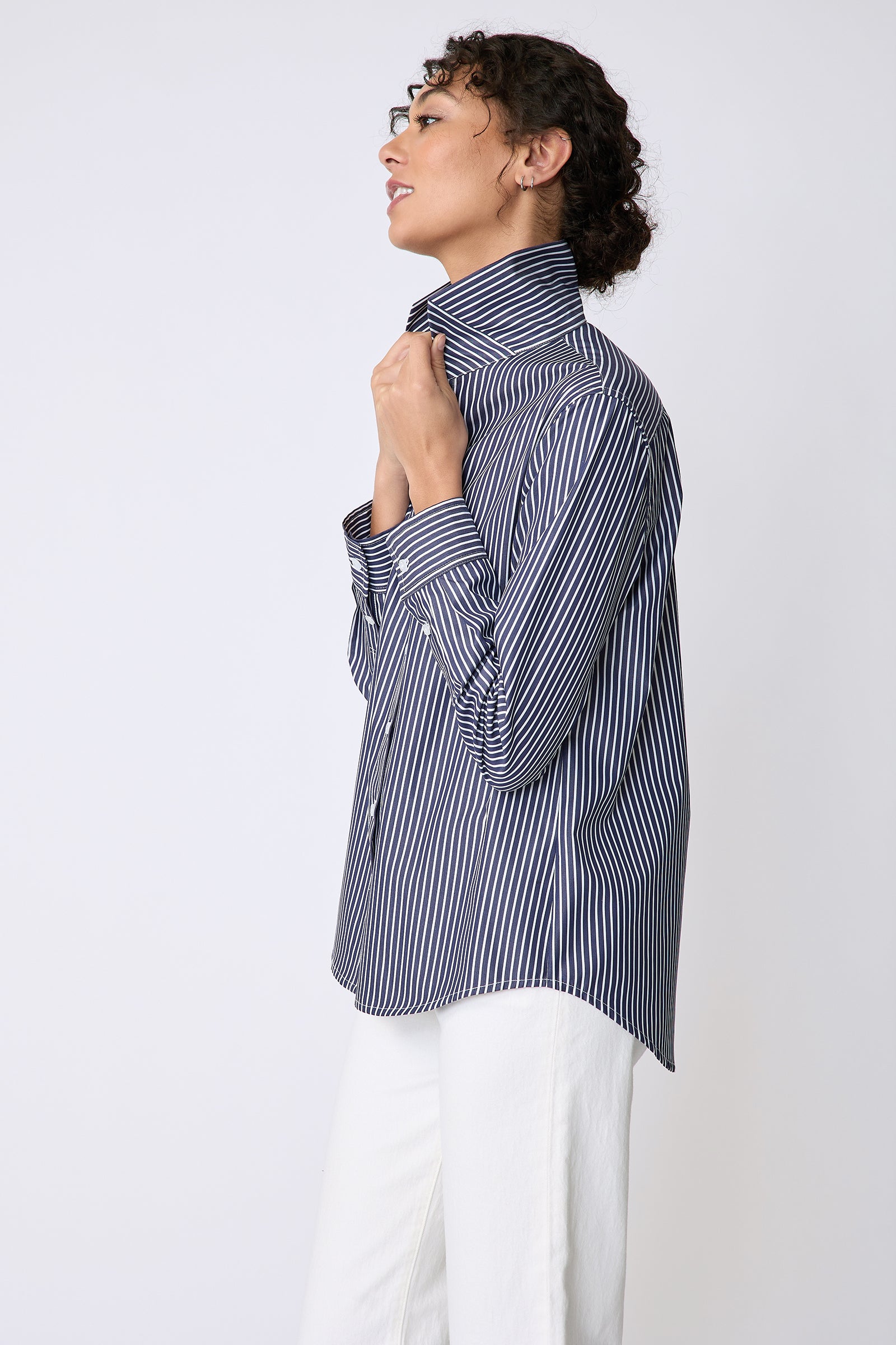 Kal Rieman Ginna Box Pleat Tailored Shirt in Savoy Stripe on model side view holding collar