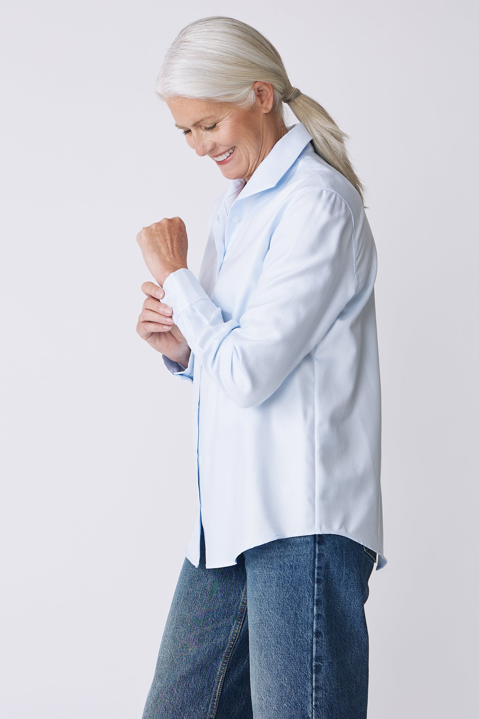 Kal Rieman Ginna Box Pleat Shirt in French Blue Herringbone on Model Side View holding cuff
