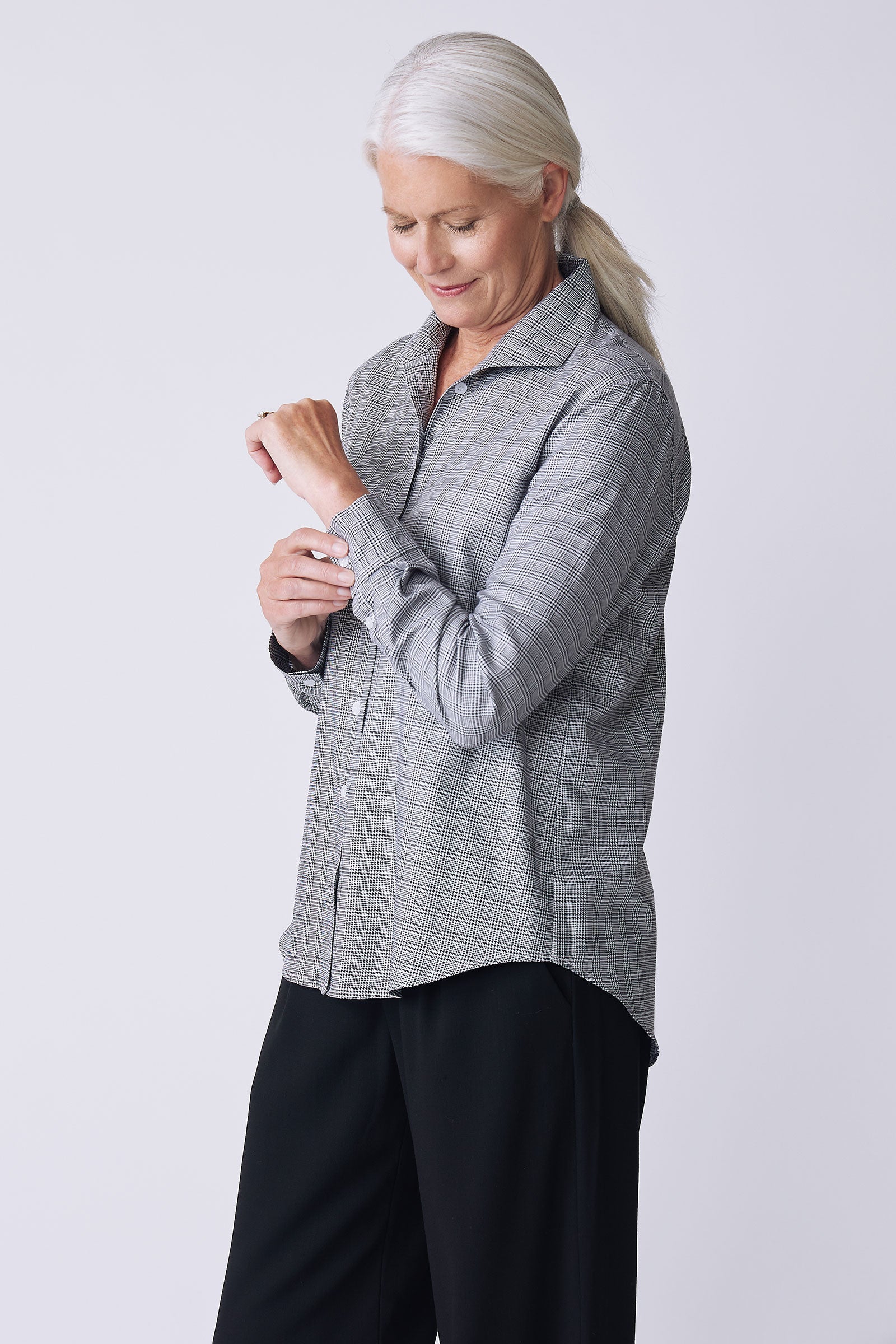 Kal Rieman Ginna Box Pleat Tailored Shirt in glenplaid black and white on model side view detail holding cuff