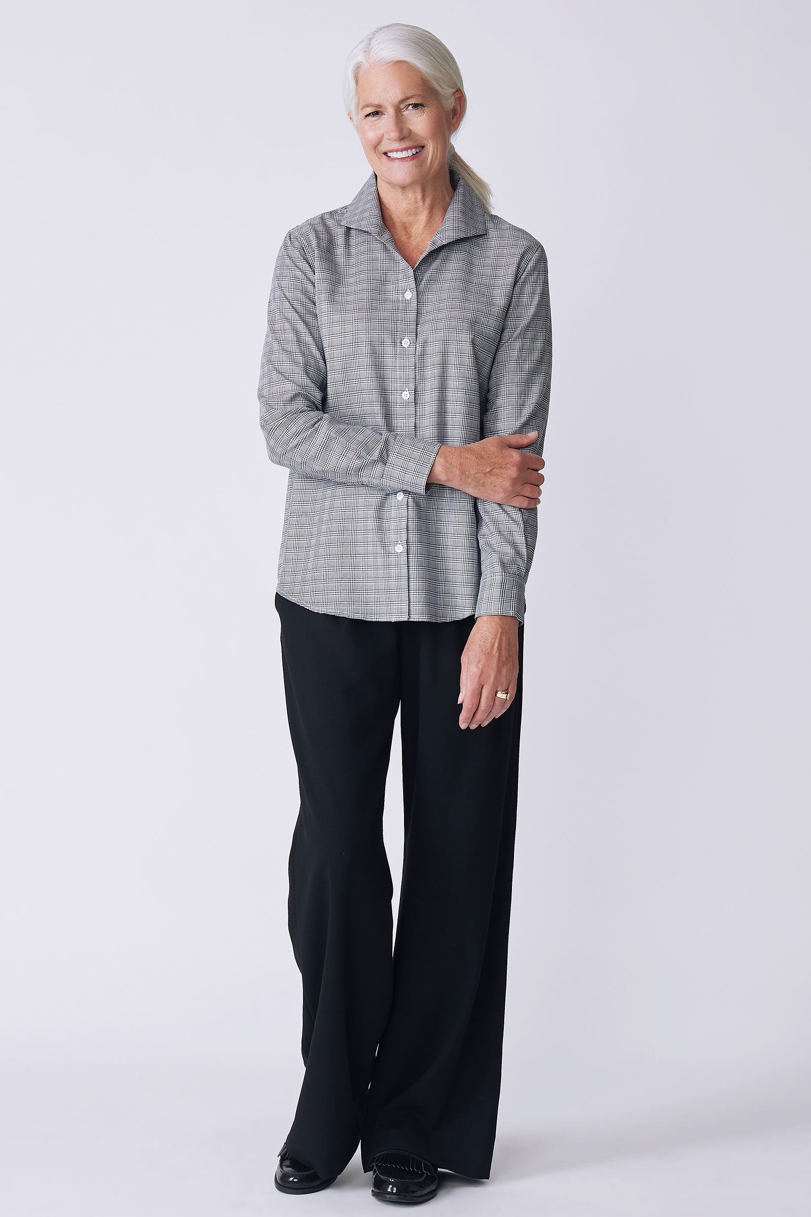 Kal Rieman Ginna Box Pleat Tailored Shirt in glen plaid black and white on model side view full look holding arm