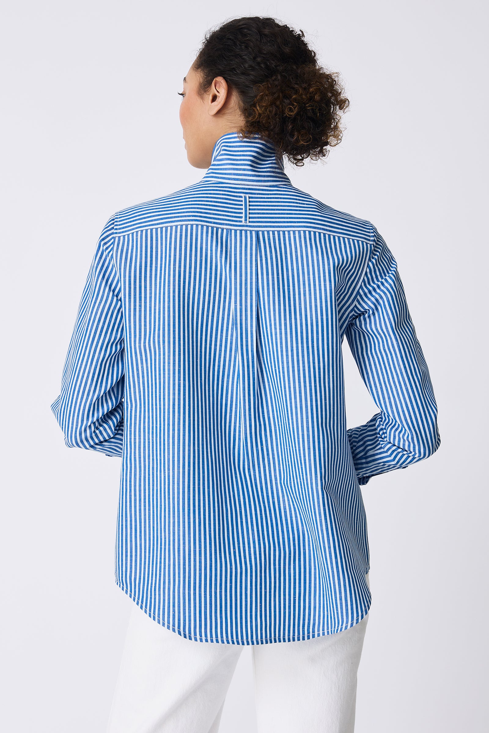 Kal Rieman Ginna Box Pleat Shirt in Cabana Stripe Blue on model smiling front view