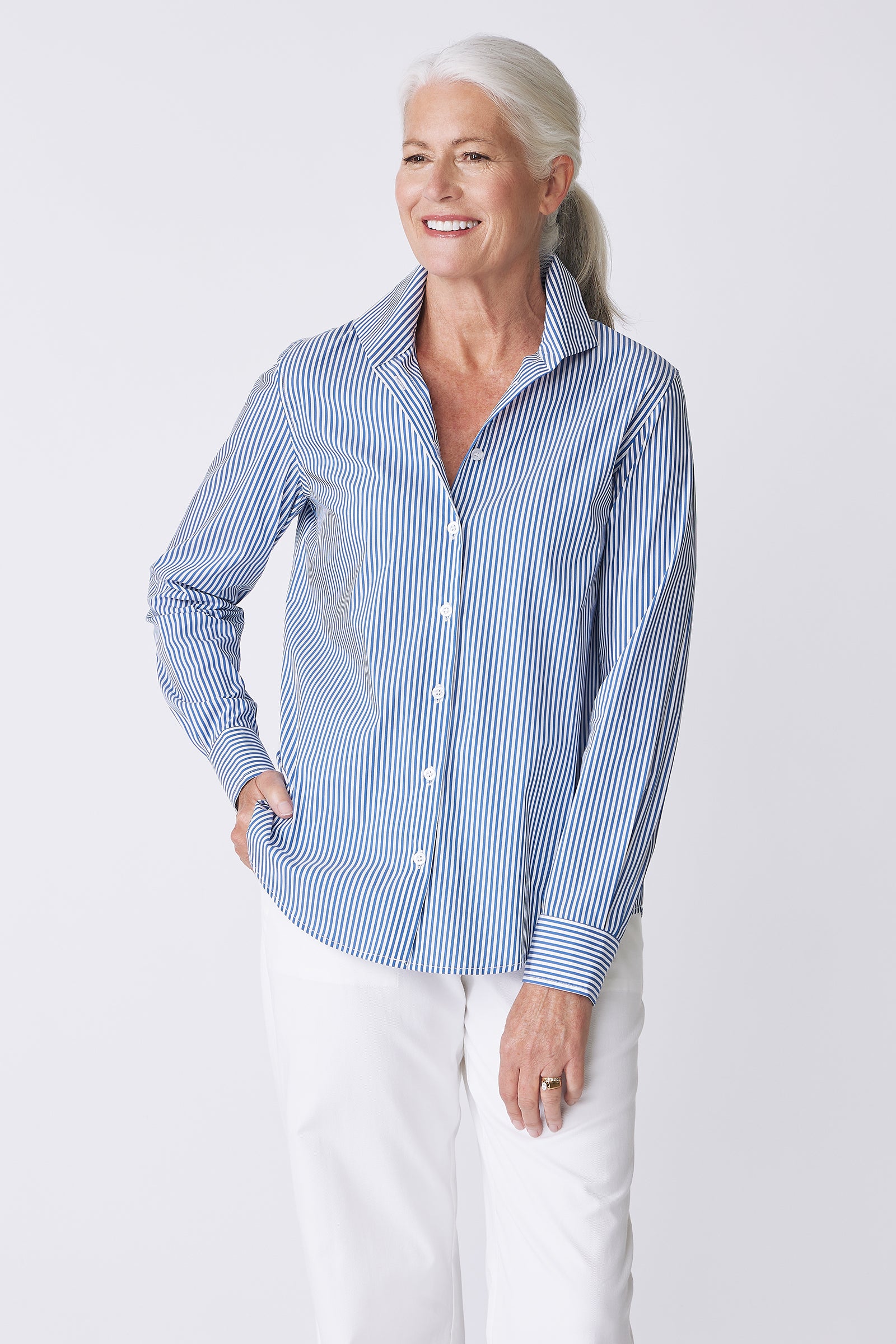 Kal Rieman image of the Ginna Box Pleat Shirt in Miami Stripe Blue on model looking to the side front view
