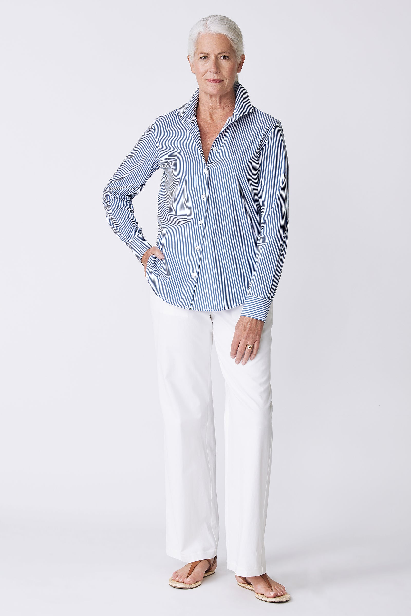 Kal Rieman image of the Ginna Box Pleat Shirt in Miami Stripe Blue on model standing with hand on hip