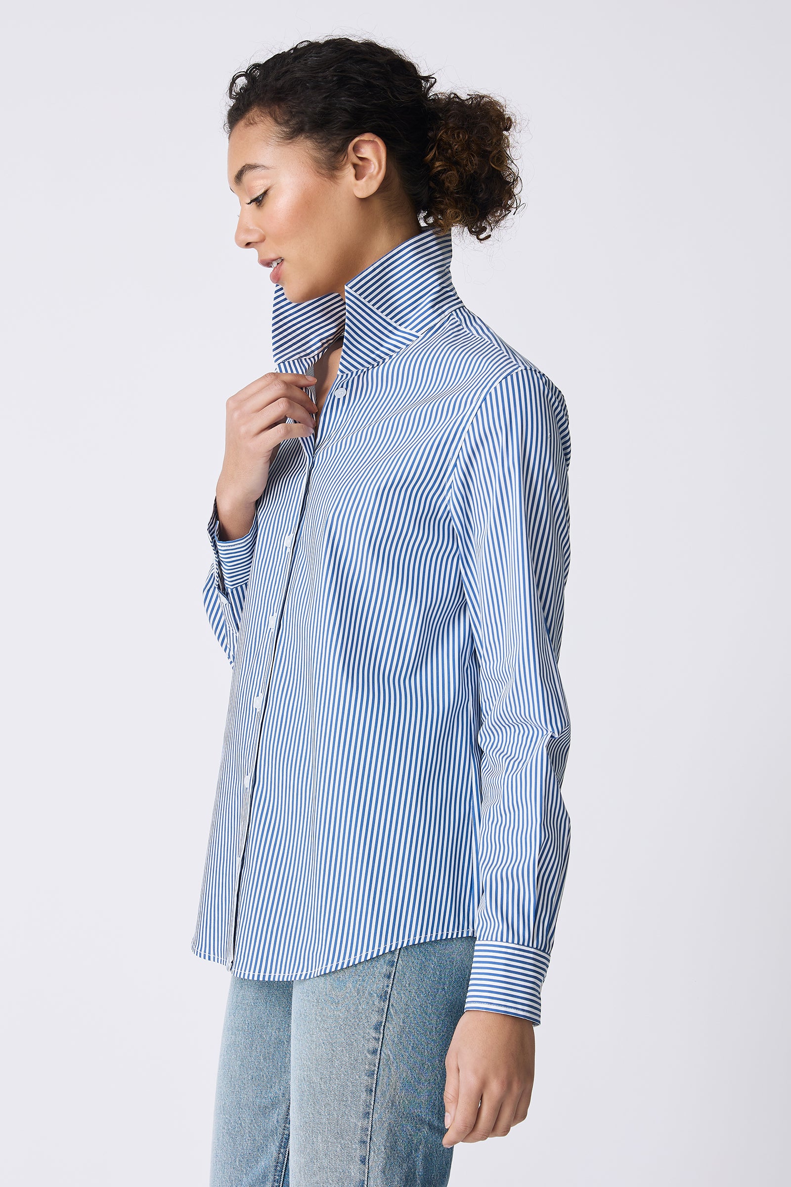 Kal Rieman image of the Ginna Box Pleat Shirt in Miami Stripe Blue on model looking down side view