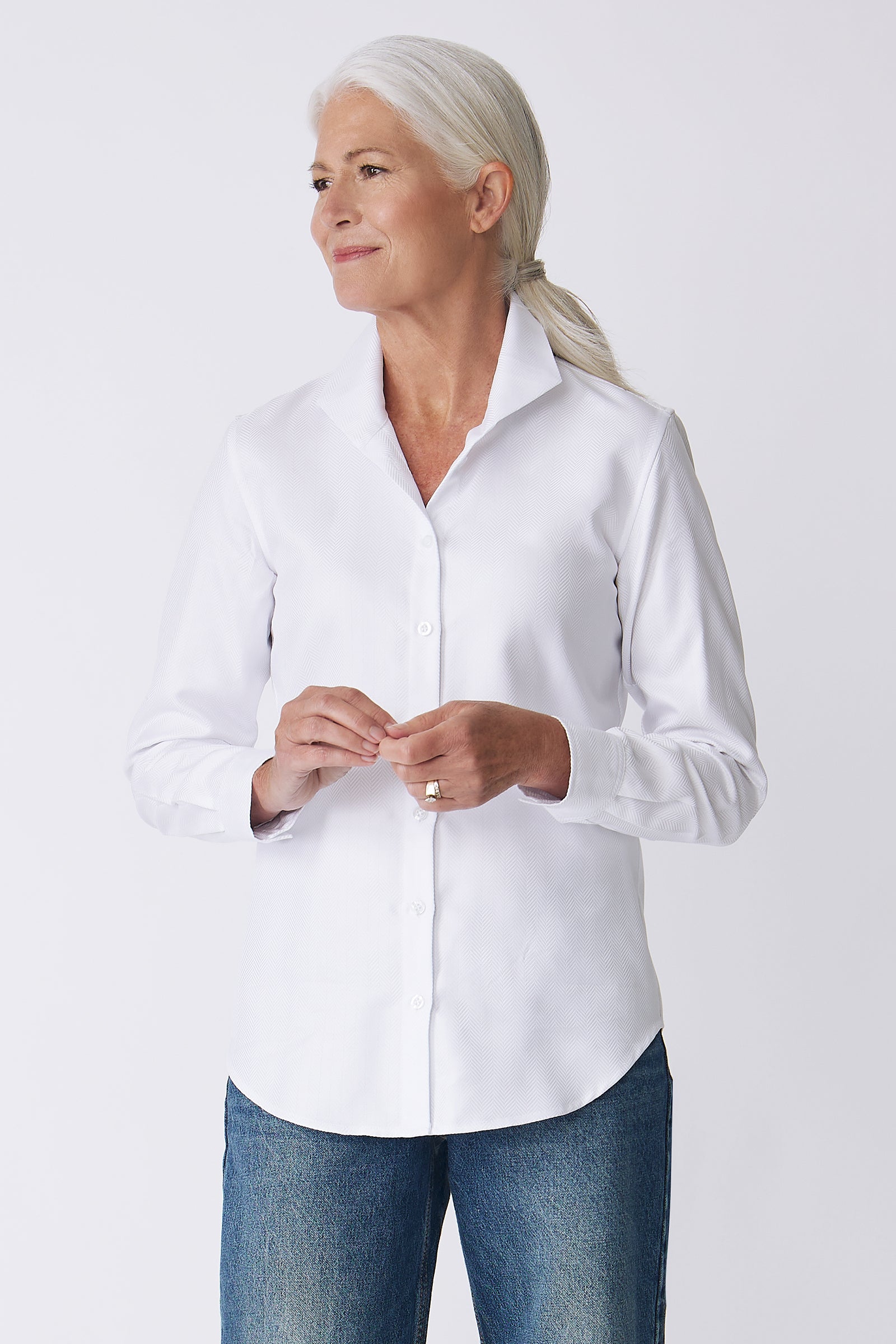 Kal Rieman Ginna Box Pleat Shirt in White Herringbone on Model Front view hands touching