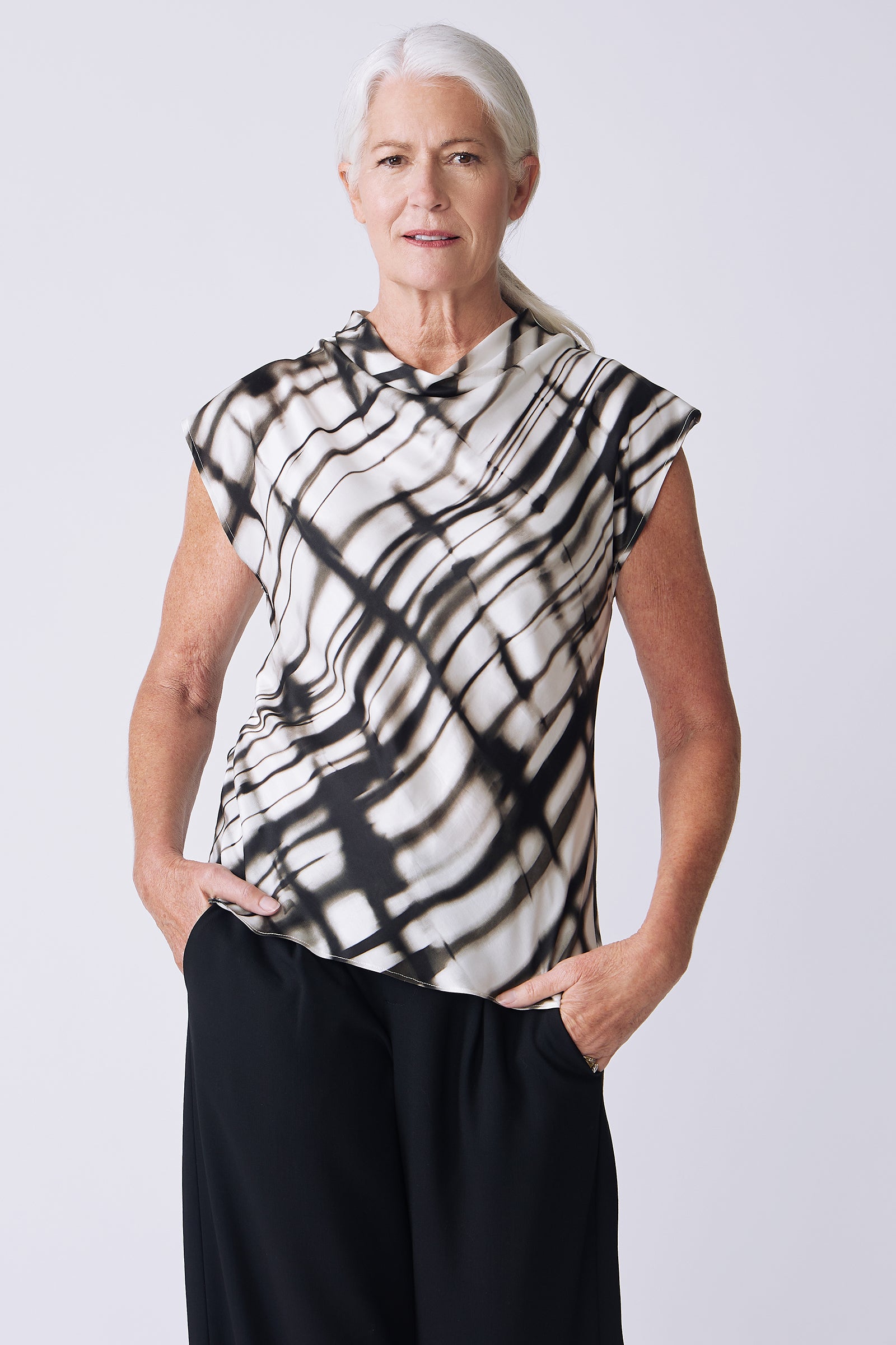Kal Rieman Gloria Top in water color on model front view hands in pockets