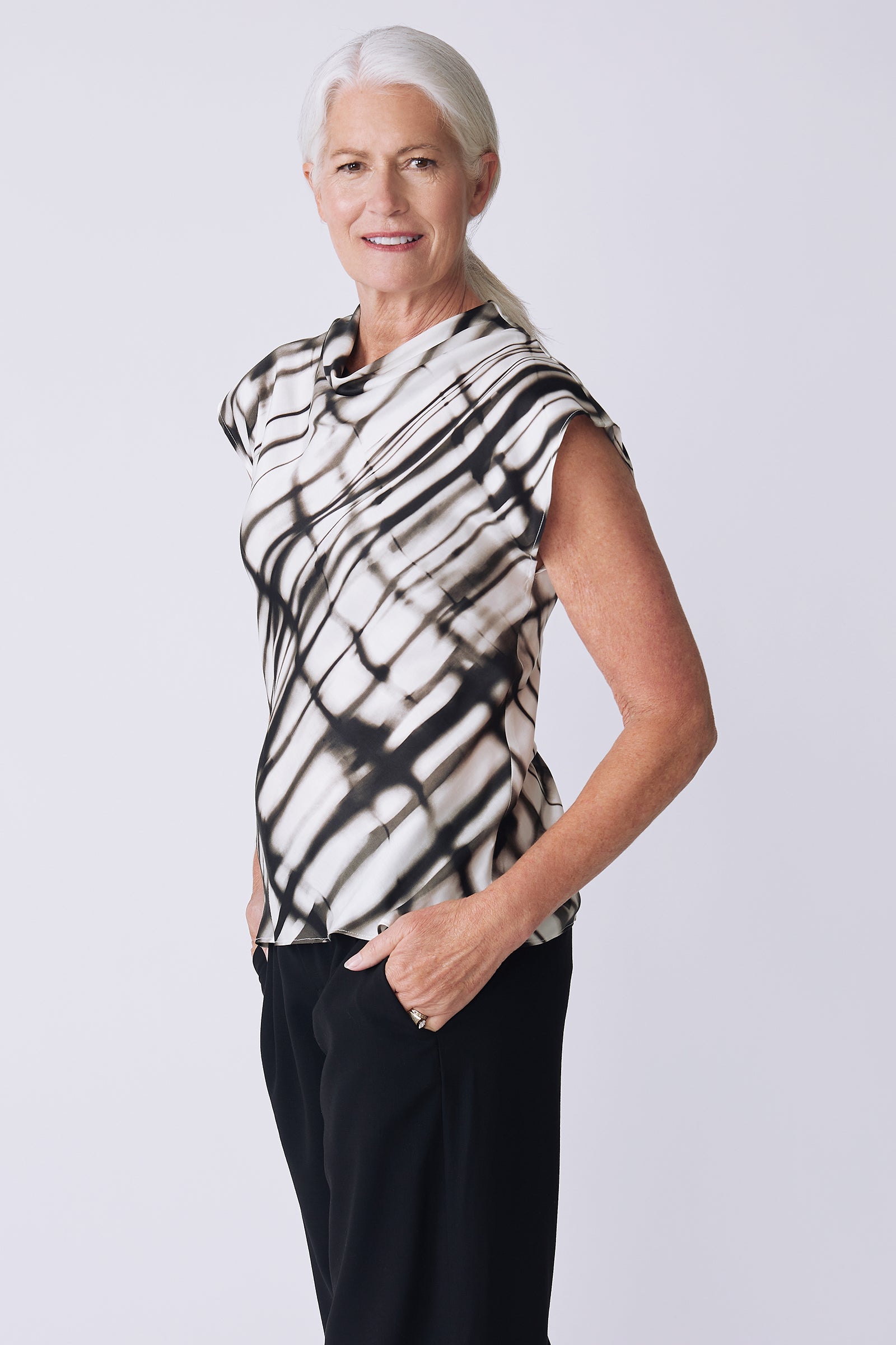 Kal Rieman Gloria Top in water color on model side view hands in pockets