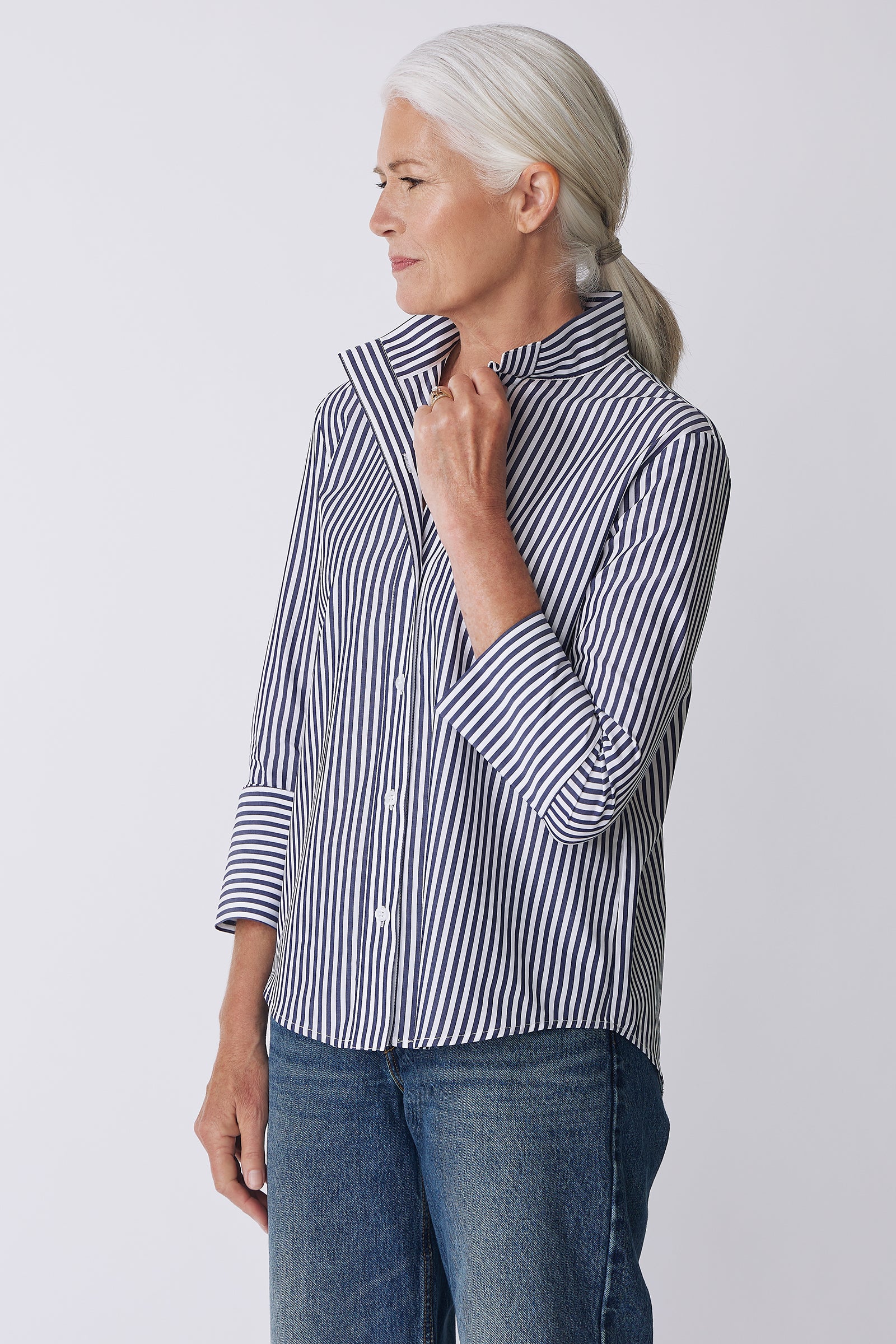 Kal Rieman Greta Placket Front Shirt in Indigo Stripe on Model Side View detail with hand on collar