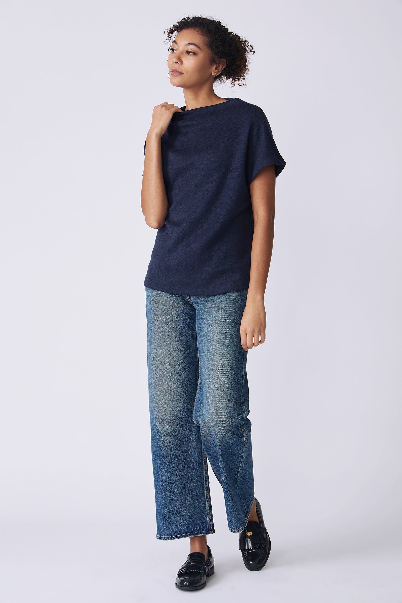 Kal Rieman Hanna Top in navy brushed knit on model side view full holding collar