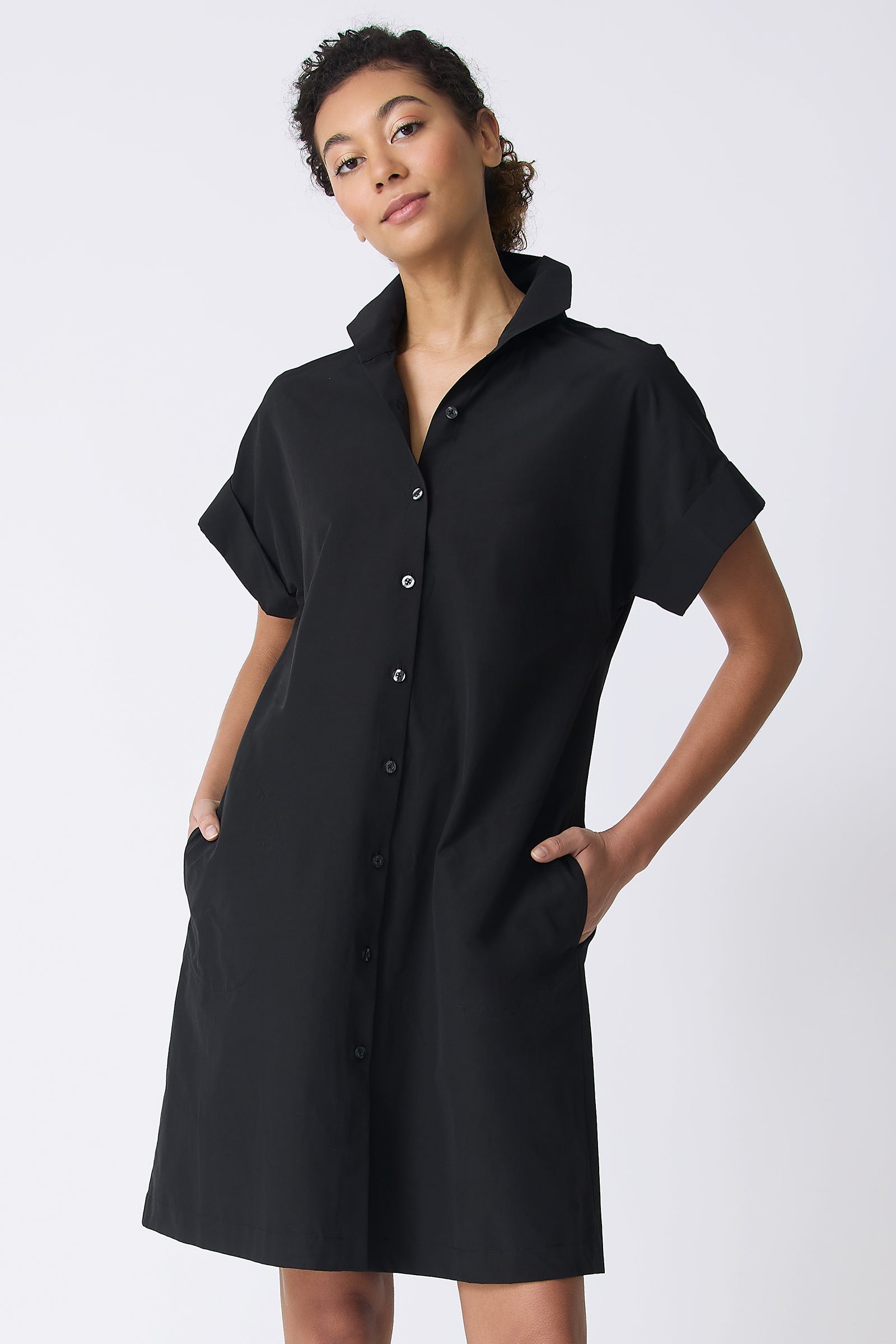 Kal Rieman Holly Kimono Dress in Black on model with hands in pockets front view