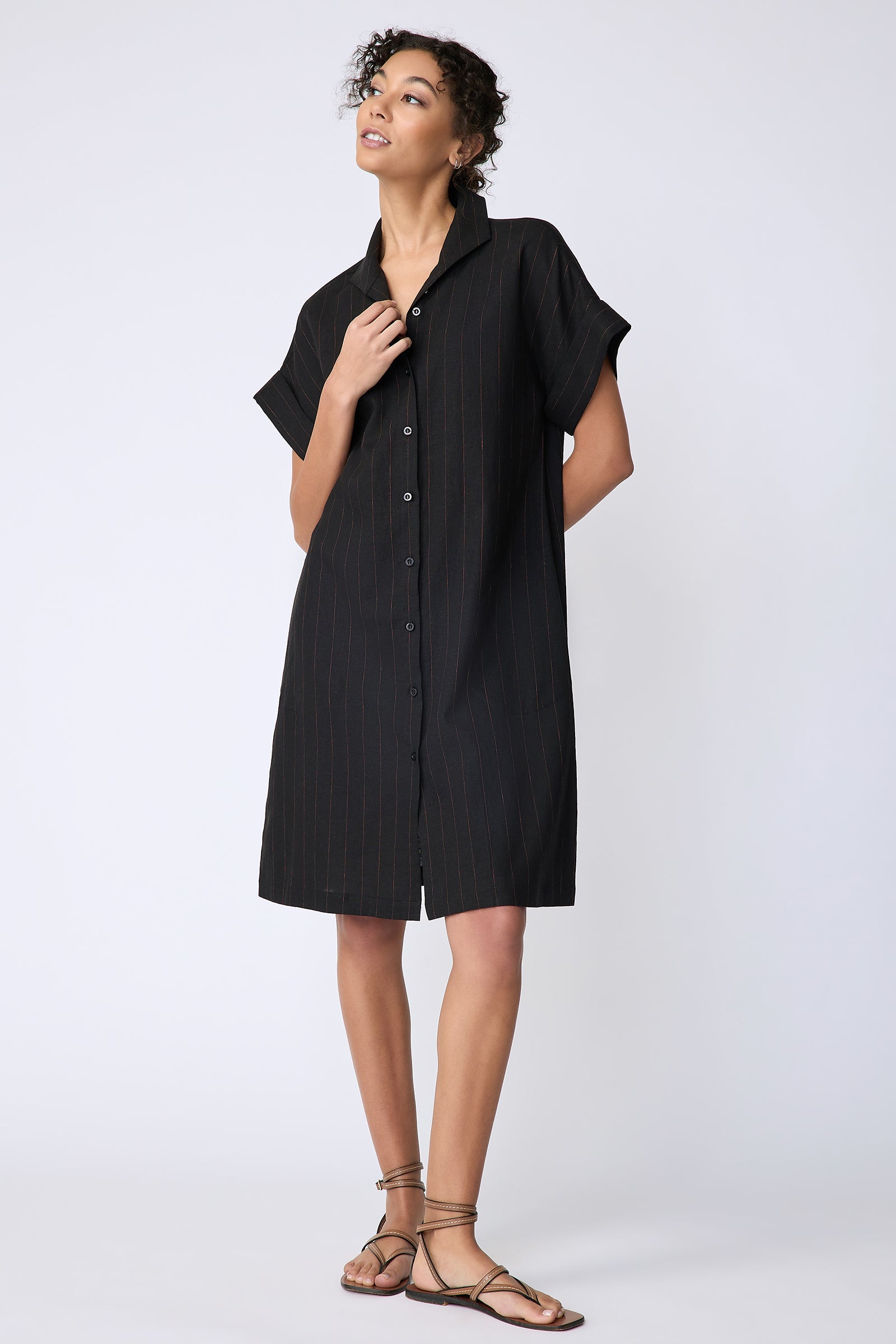 Kal Rieman Holly Kimono Dress in black pinstripe linen on model front view hand on placket