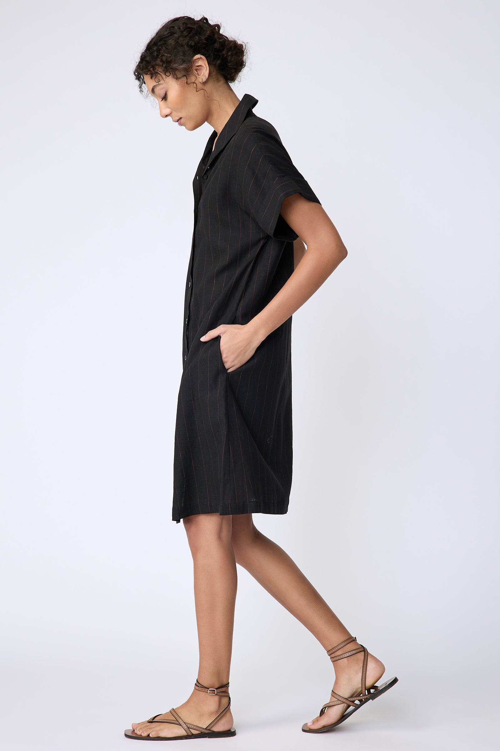 Kal Rieman Holly Kimono Dress in black pinstripe linen on model side view walking