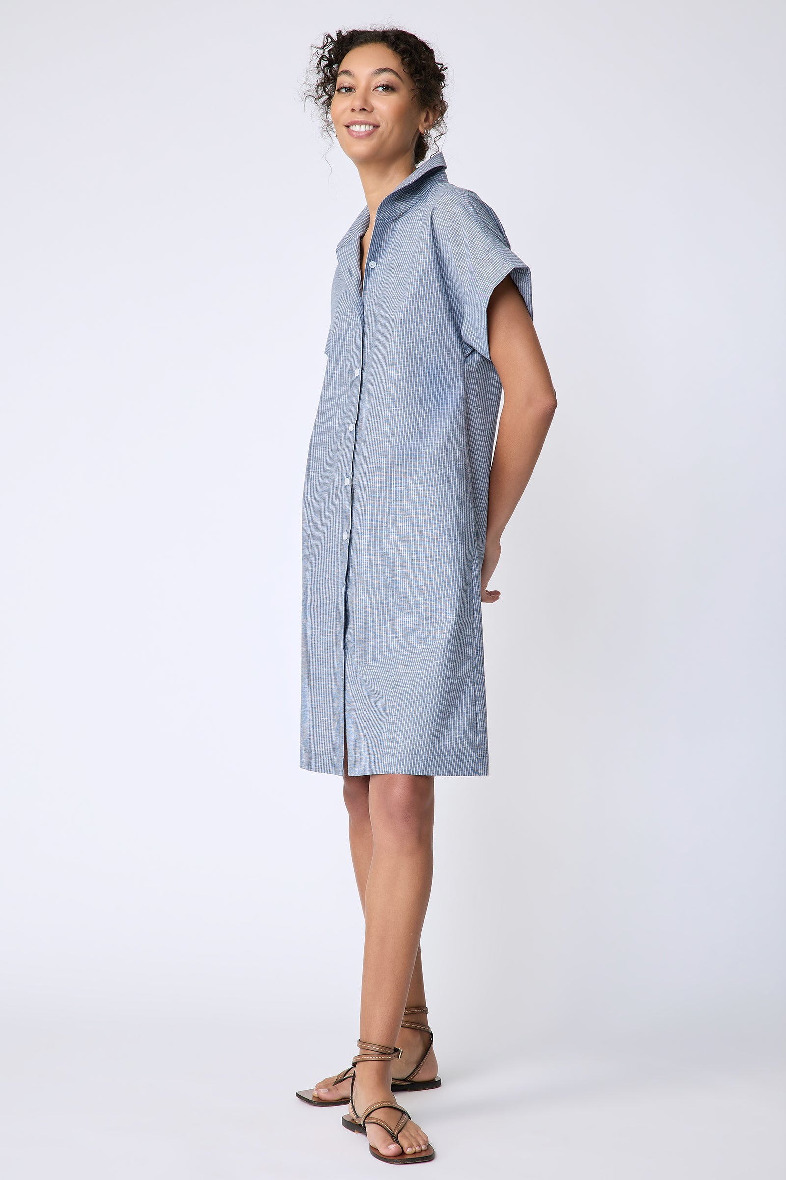 Kal Rieman Holly Kimono Dress in dark indigo mini stripe on model front hands behind back
