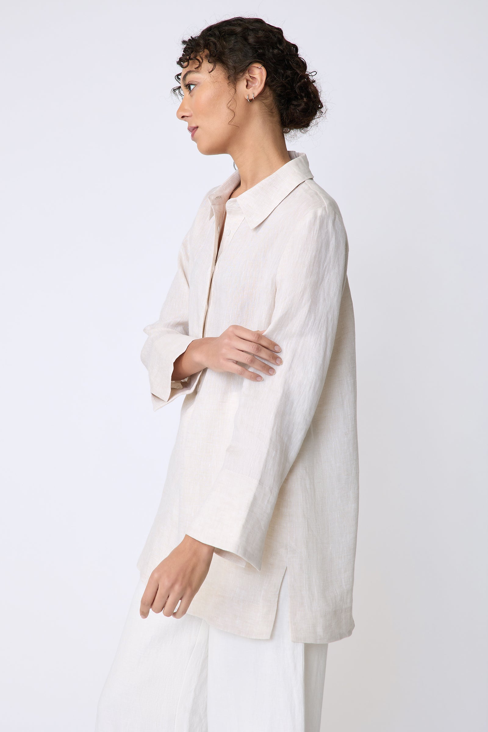 Kal Rieman Inez Placket Tunic in linen color sand on side view holding arm