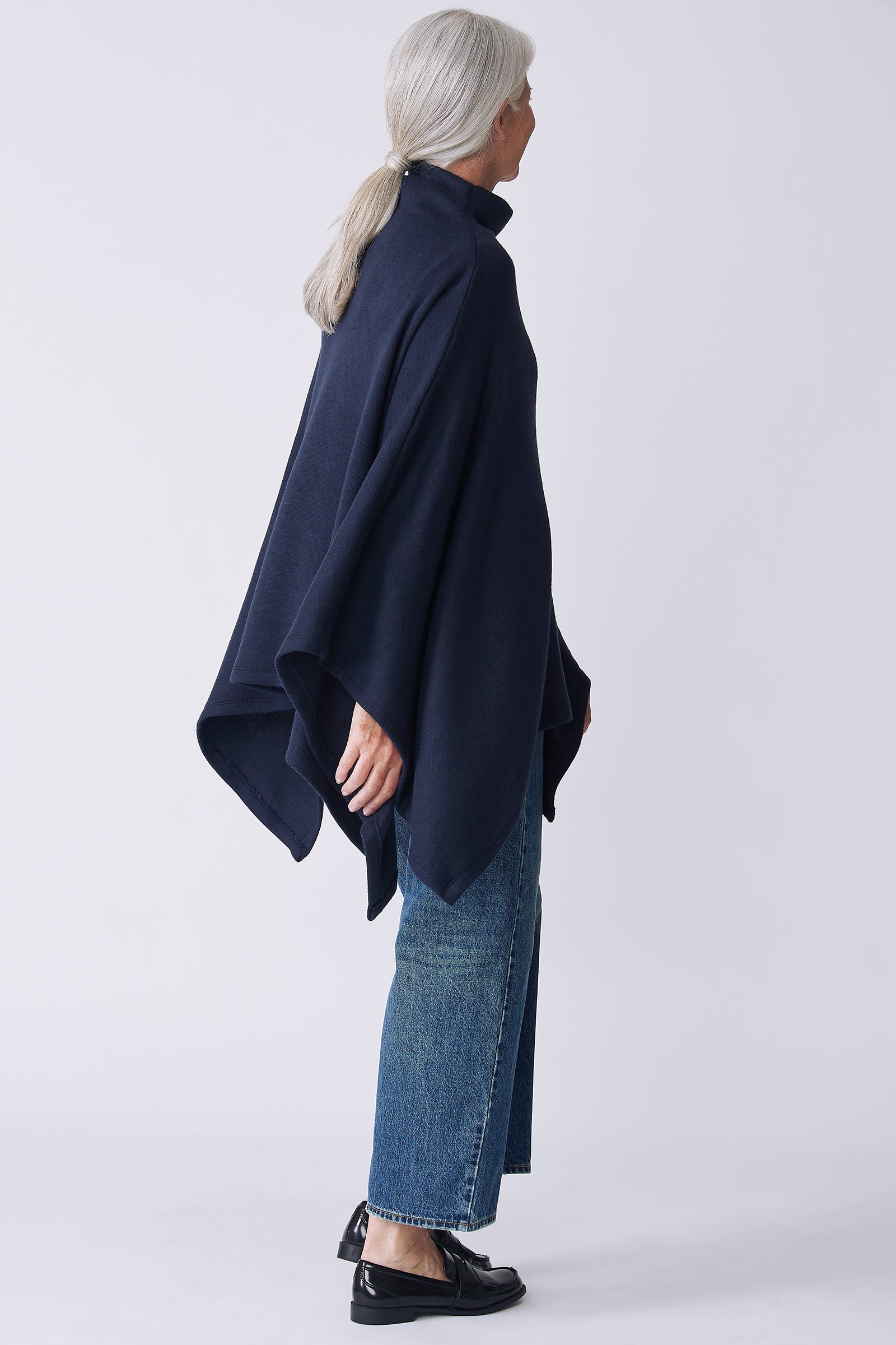 Kal Rieman Jackie Cape in blue knit on model back view