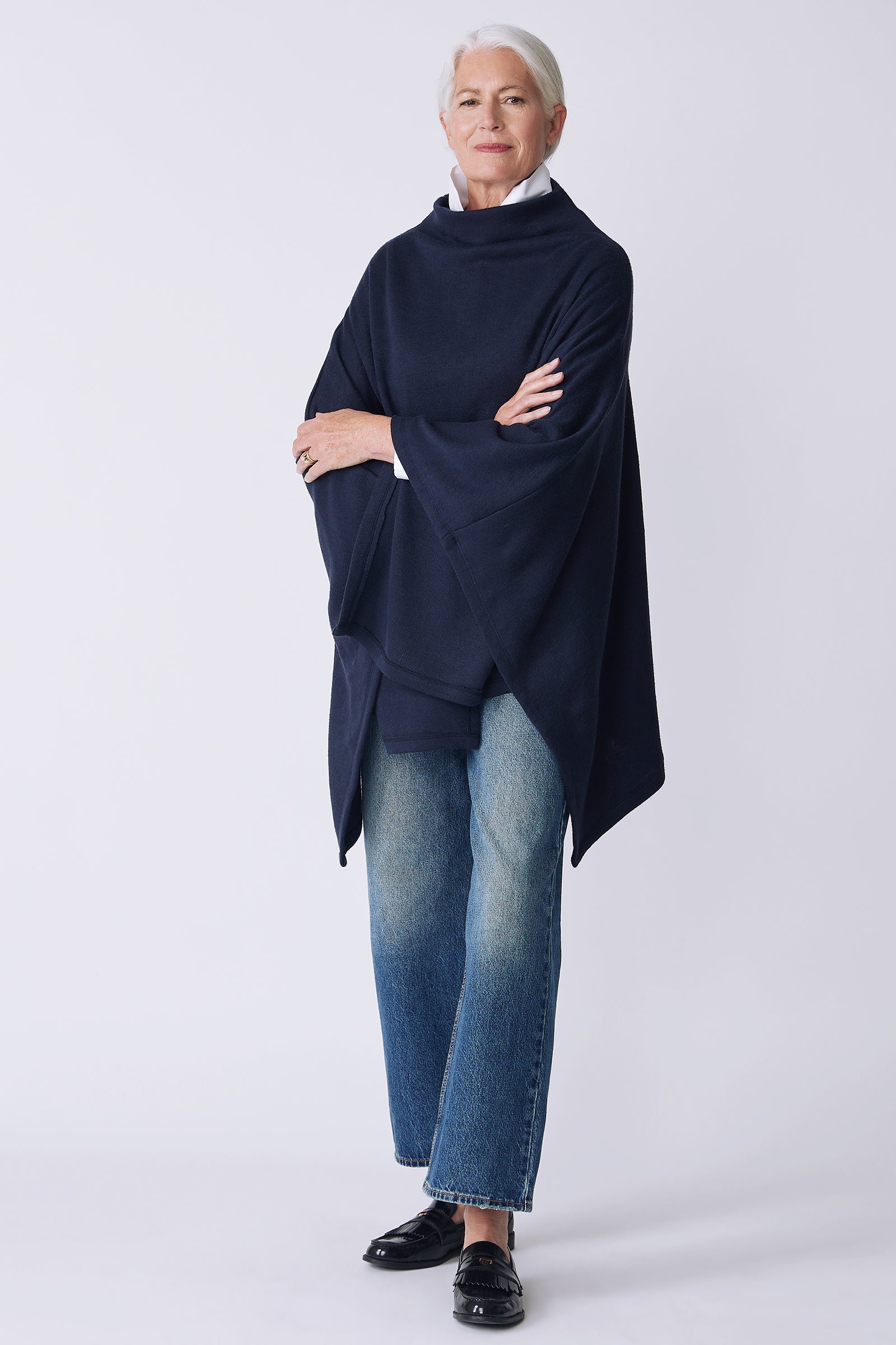 Kal Rieman Jackie Cape in blue knit on model front view arms crossed
