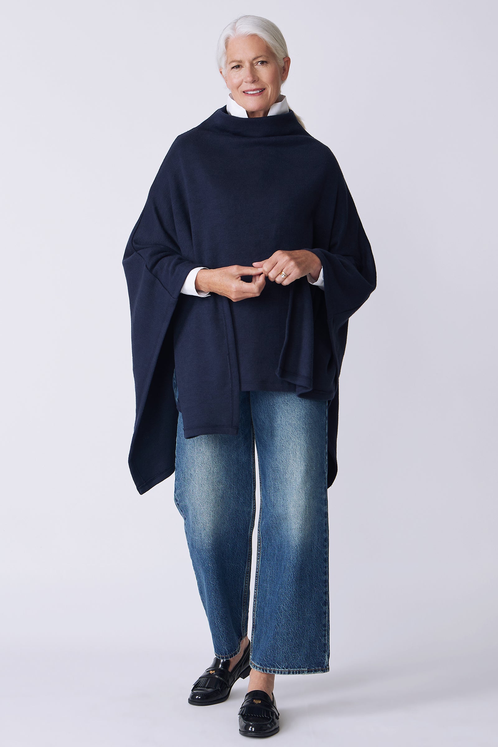 Kal Rieman Jackie Cape in blue knit on model front view arms crossed