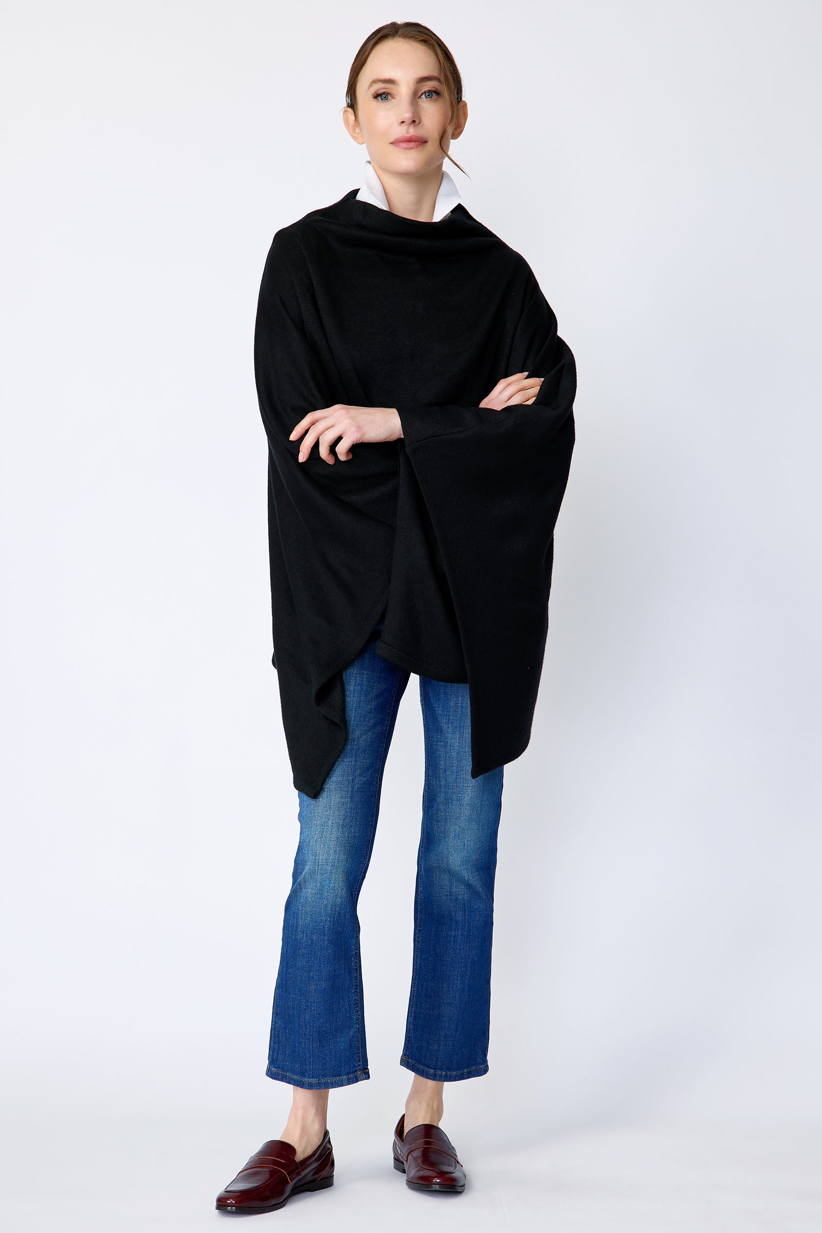 Kal Rieman Jackie Poncho in black soft knit on model front view full arms crossed in front