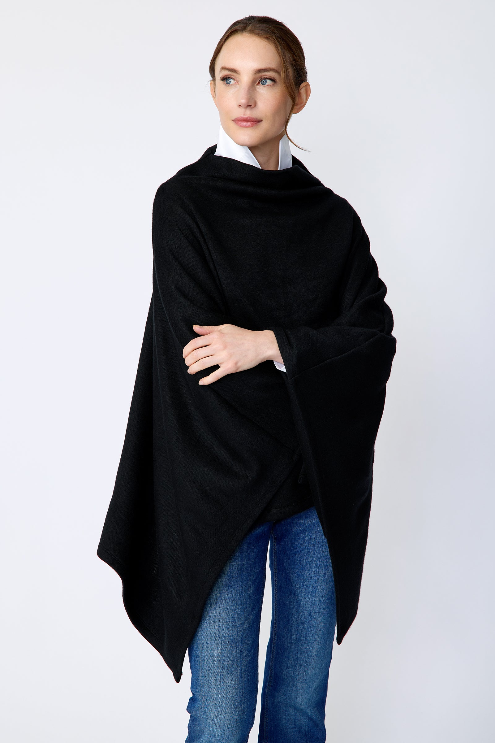Kal Rieman Jackie Poncho in black soft knit on model side view
