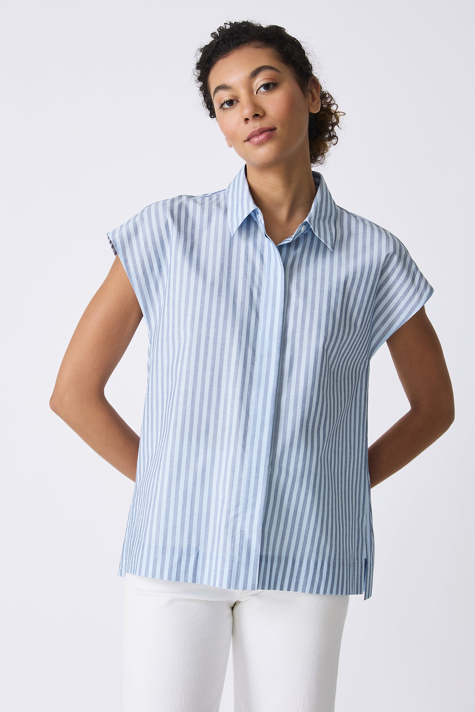 Kal Rieman Jane Cap Sleeve Shirt in Cabana Stripe Blue on model with hands behind back front view