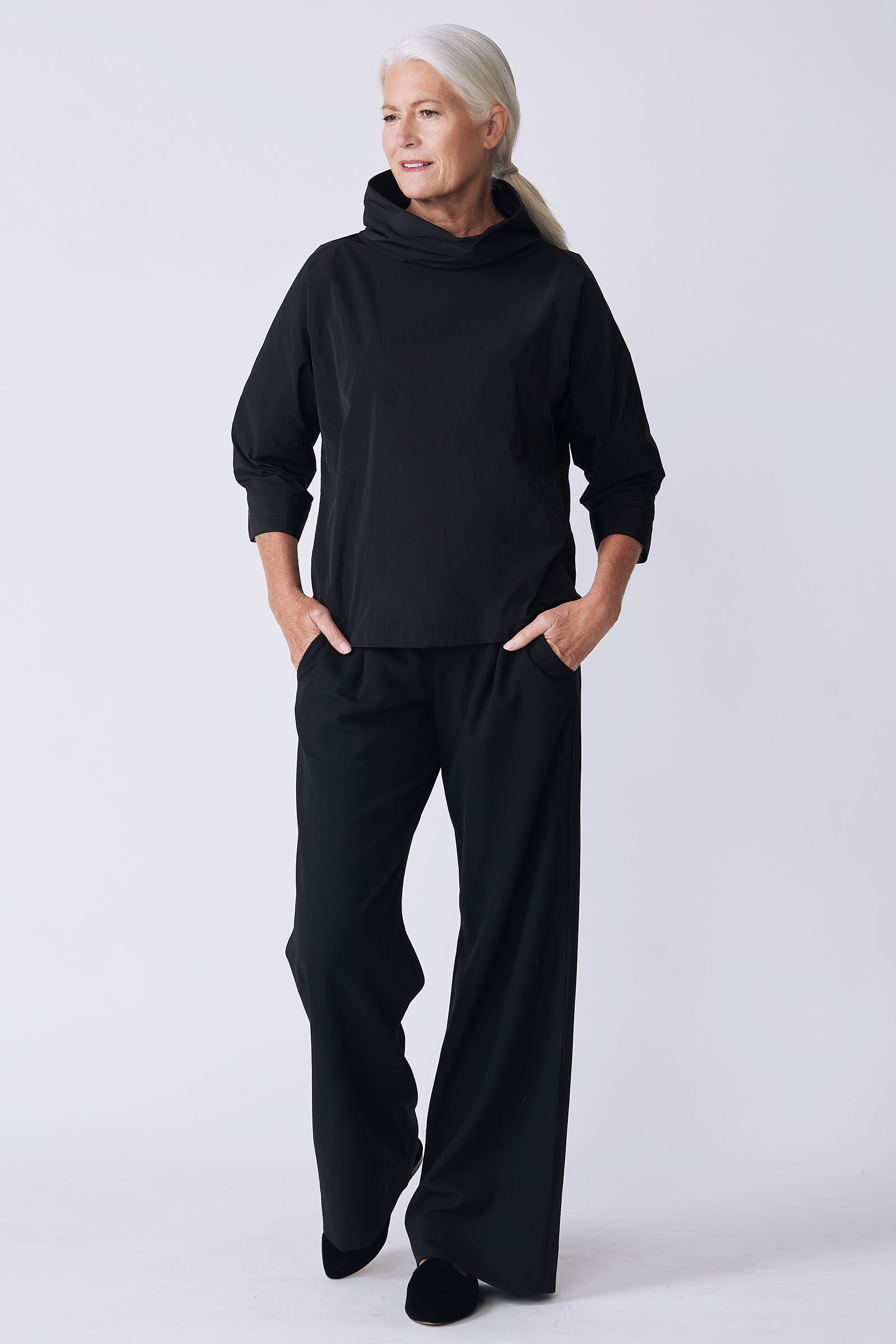 Kal Rieman Julia Taffeta Top in black on model side view walking
