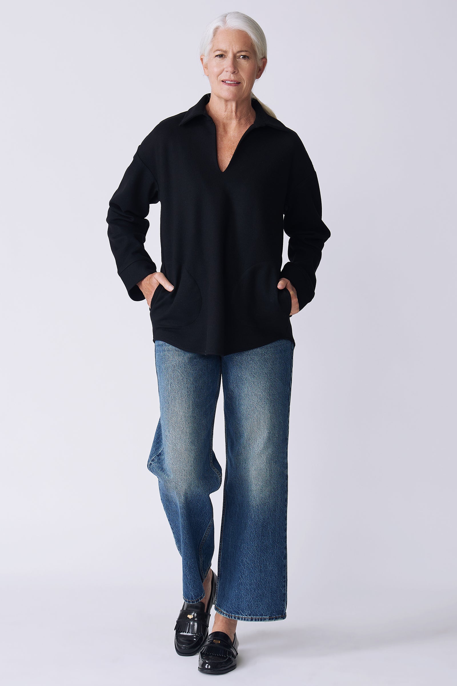 Kal Rieman Julian pullover in black felted jersey on model front view walking