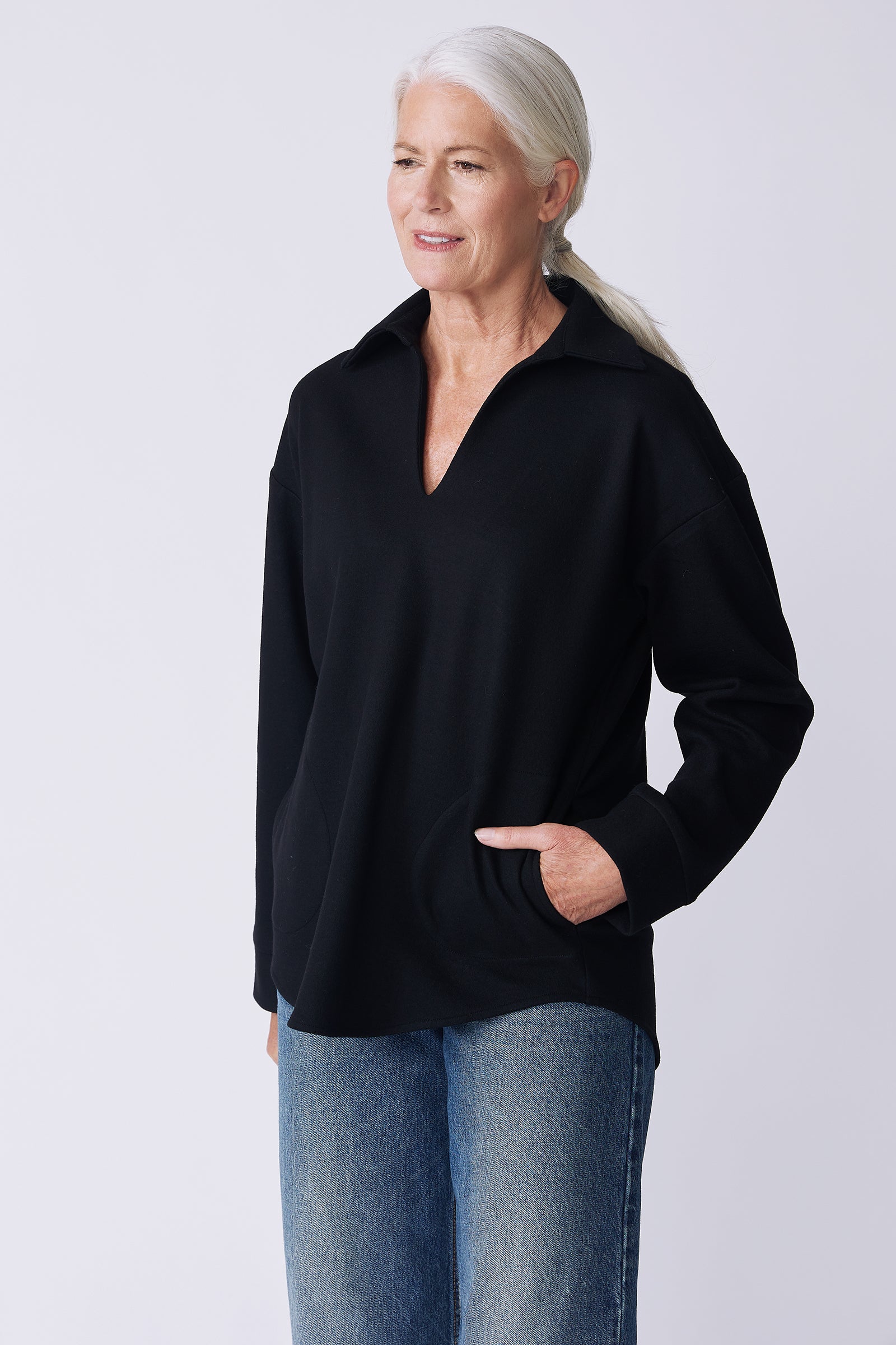 Kal Rieman Julian pullover in black felted jersey on model side view hand in pocket