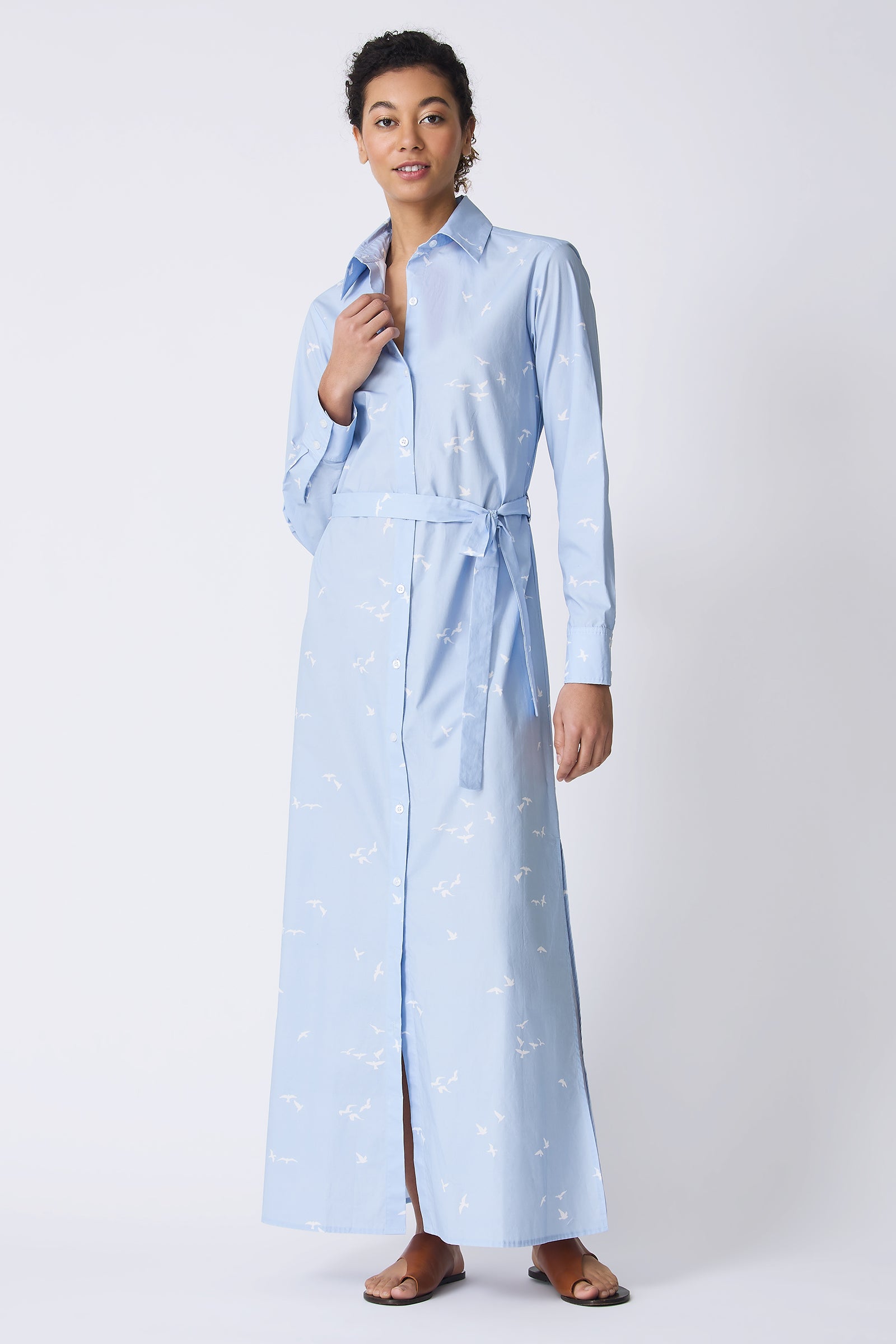 Kal Rieman June Maxi Dress in Oxford Blue Bird Print on model touching button full front view